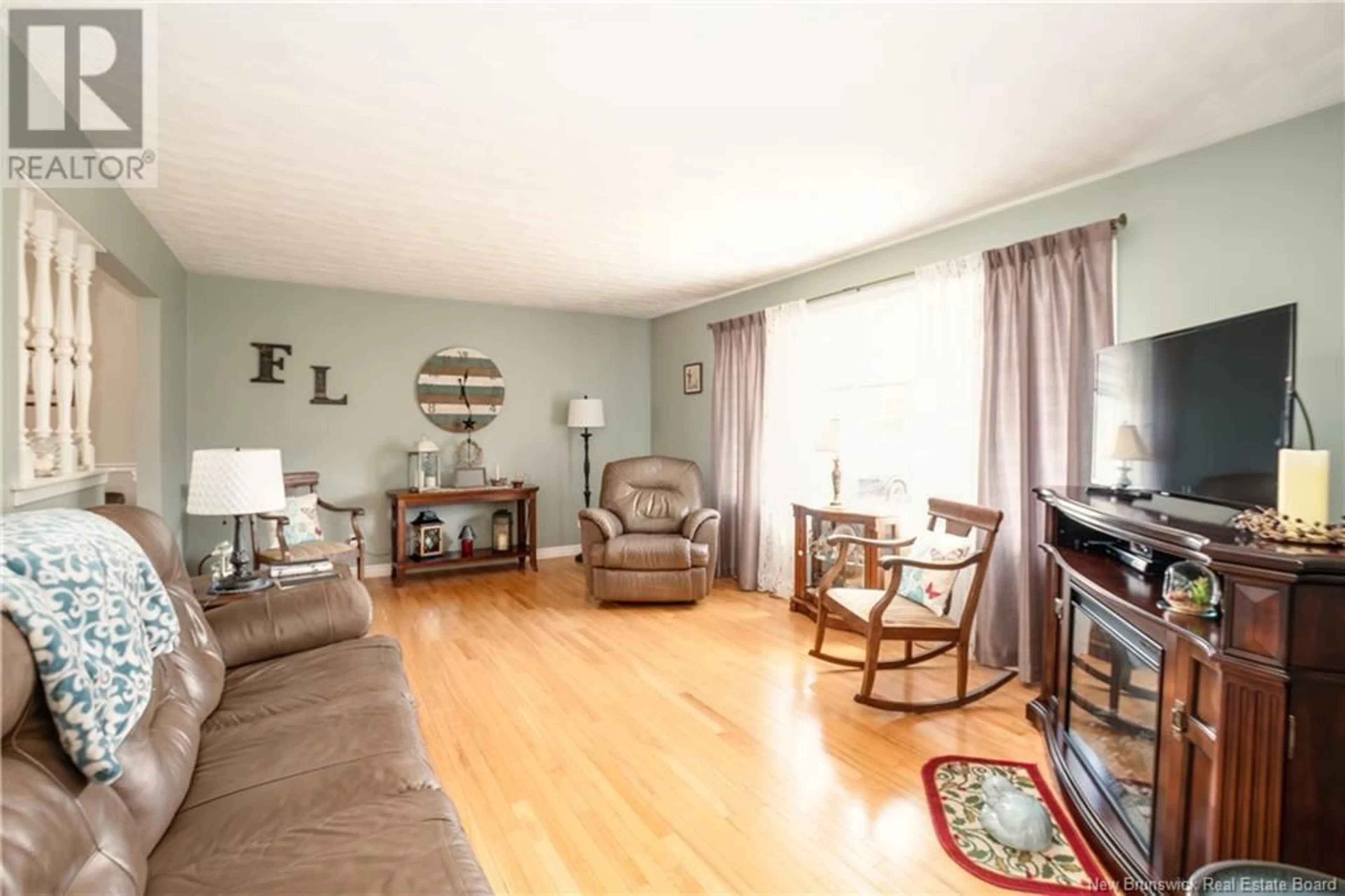 Living room with furniture, wood/laminate floor for 895 ROUTE 910, Turtle Creek New Brunswick E1J2C4
