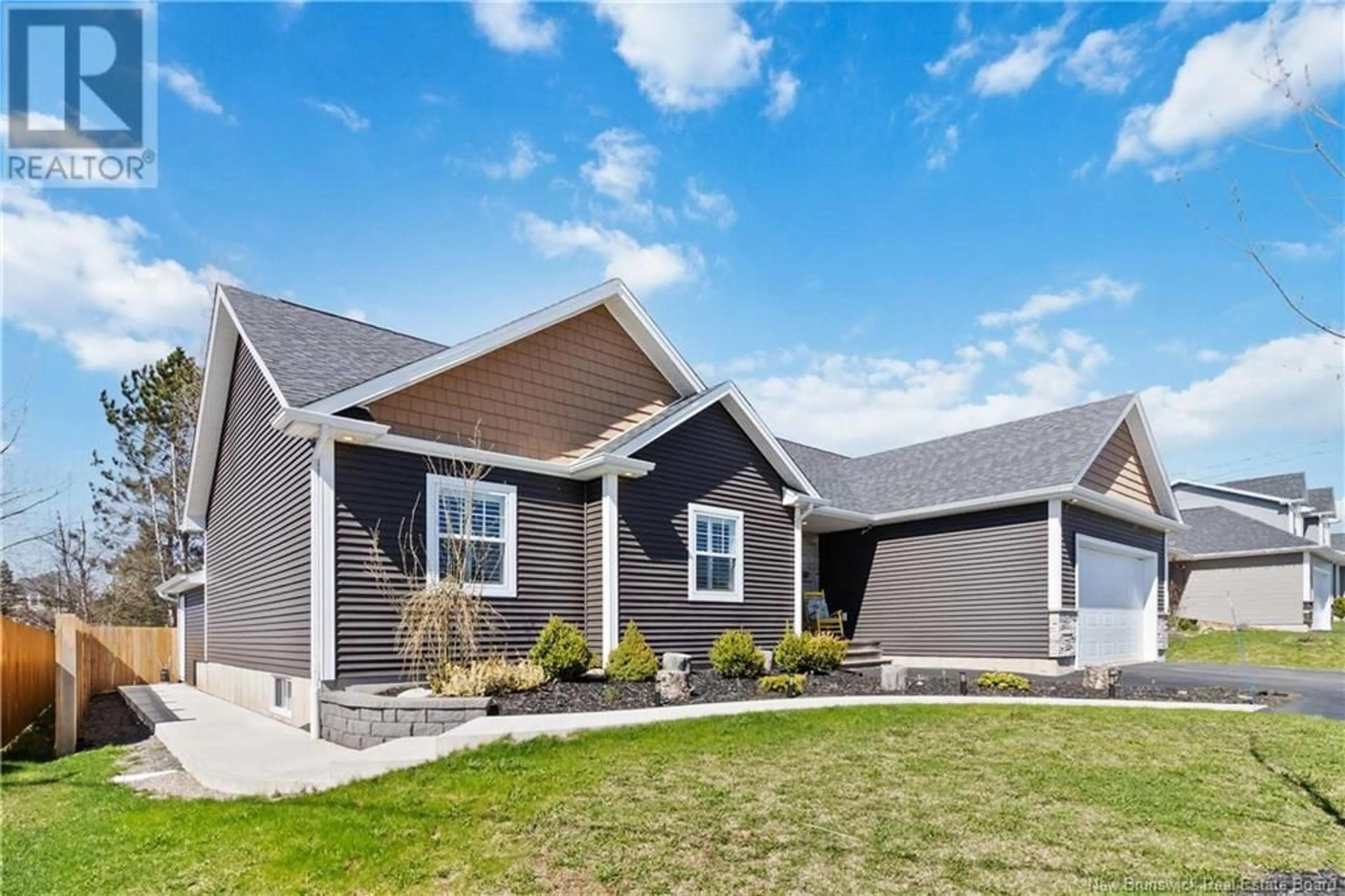 Home with vinyl exterior material, street for 40 SUZELLE, Dieppe New Brunswick E1A9R8