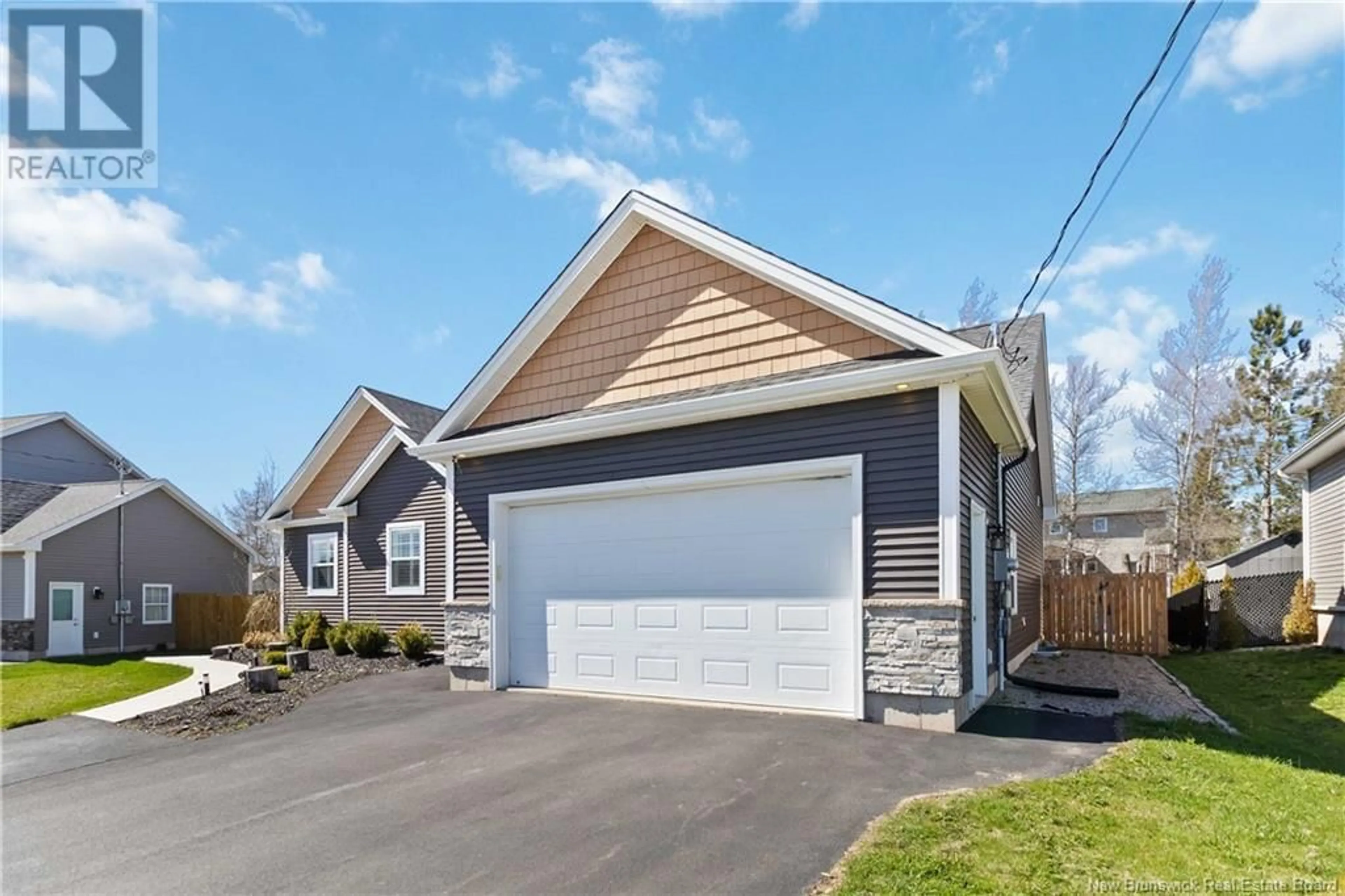 Home with vinyl exterior material, street for 40 SUZELLE, Dieppe New Brunswick E1A9R8