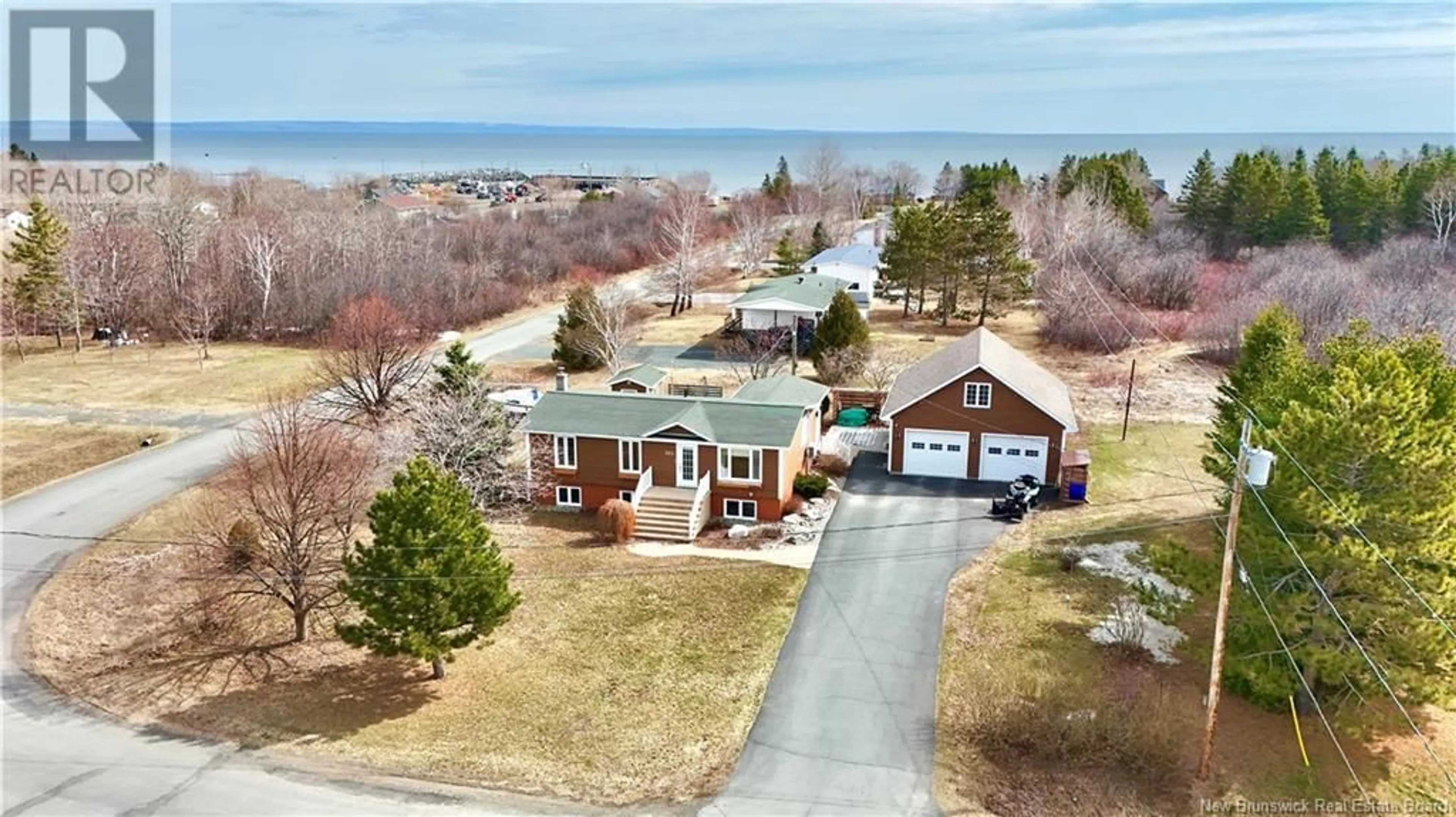 A pic from outside/outdoor area/front of a property/back of a property/a pic from drone, water/lake/river/ocean view for 353 ERIC, Pointe-Verte New Brunswick E8J2T3