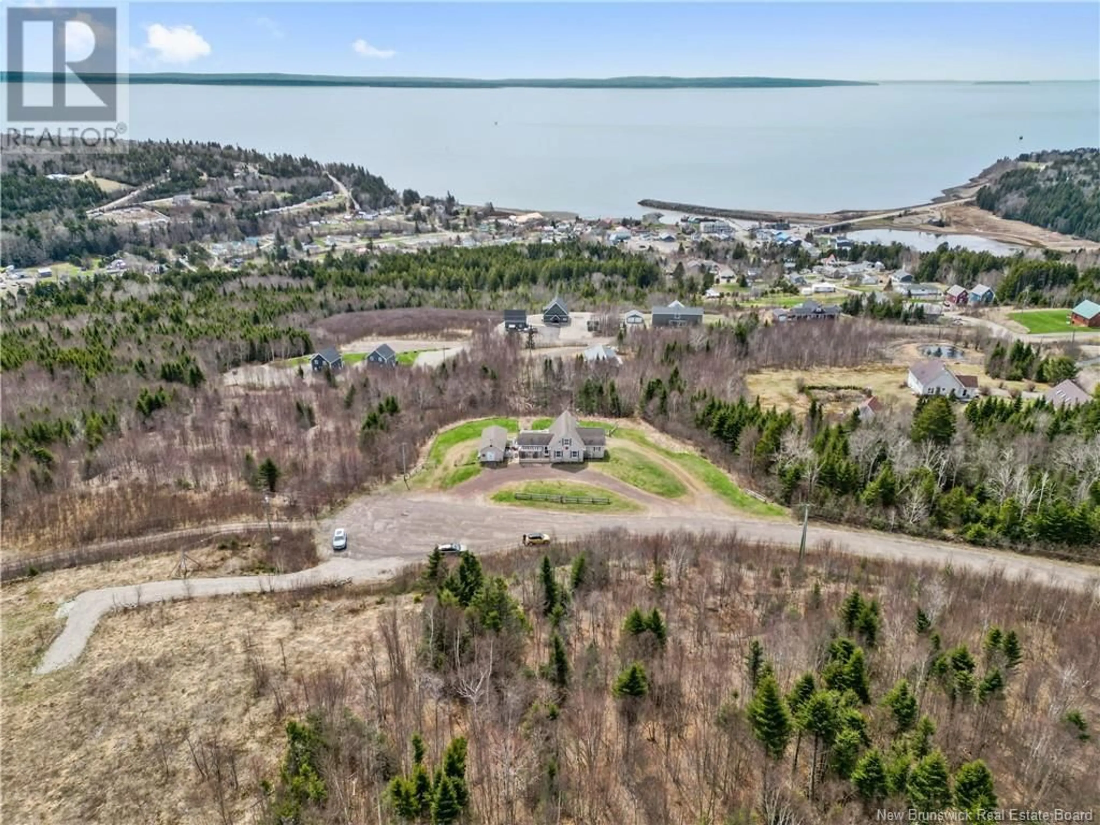 A pic from outside/outdoor area/front of a property/back of a property/a pic from drone, water/lake/river/ocean view for 4 BRITTANY COURT, Alma New Brunswick E4H0B4