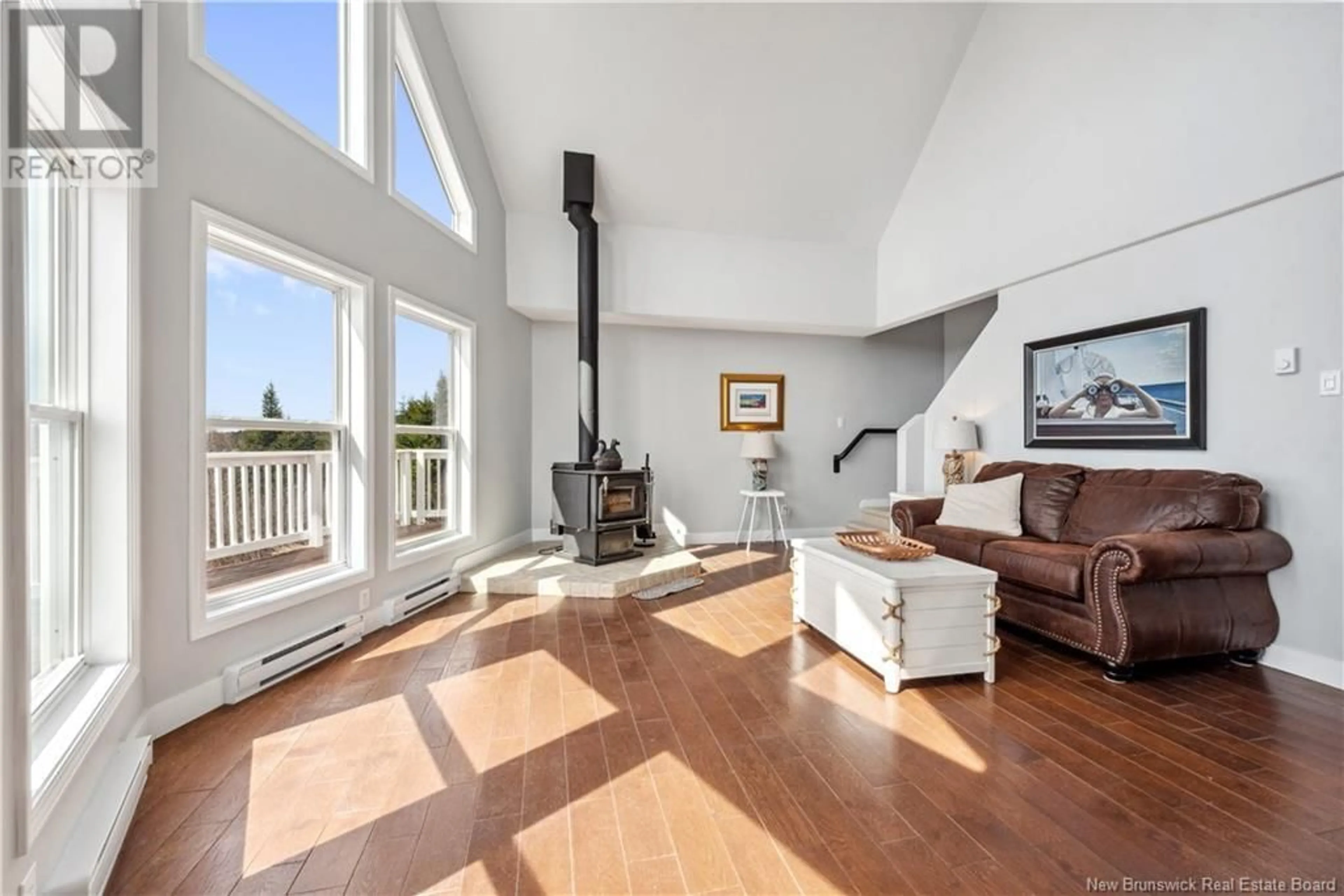 Living room with furniture, wood/laminate floor for 4 BRITTANY COURT, Alma New Brunswick E4H0B4