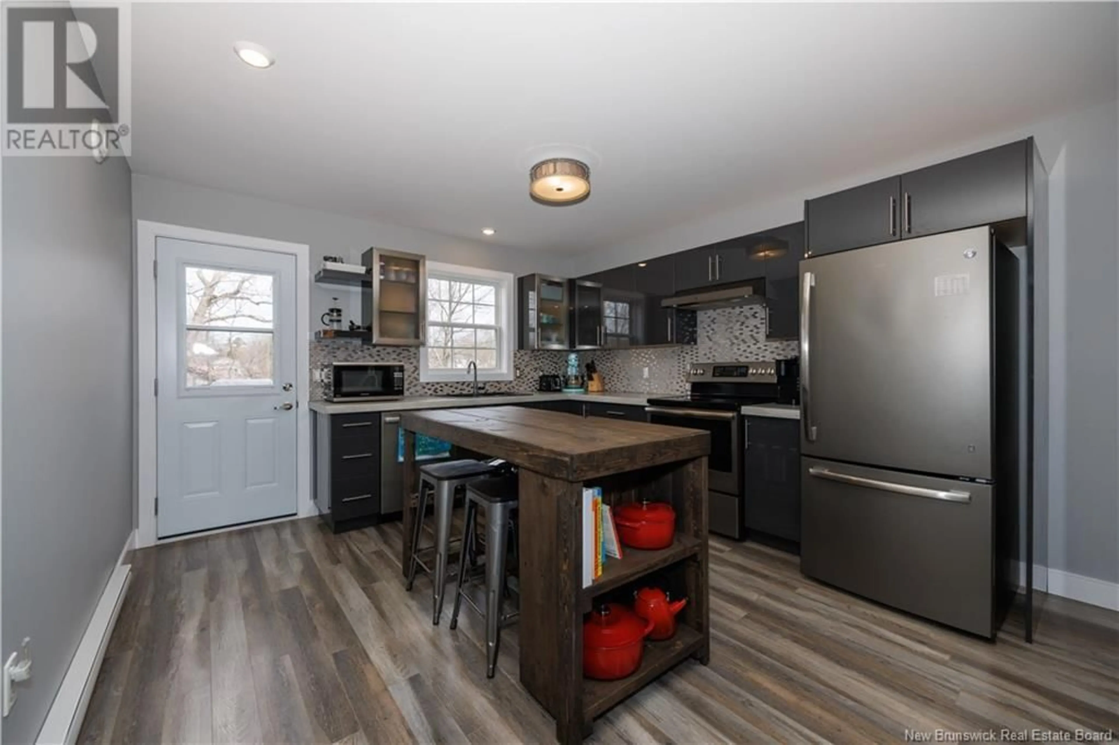Open concept kitchen, wood/laminate floor for 33 EATMAN AVENUE, Fredericton New Brunswick E3A3V7