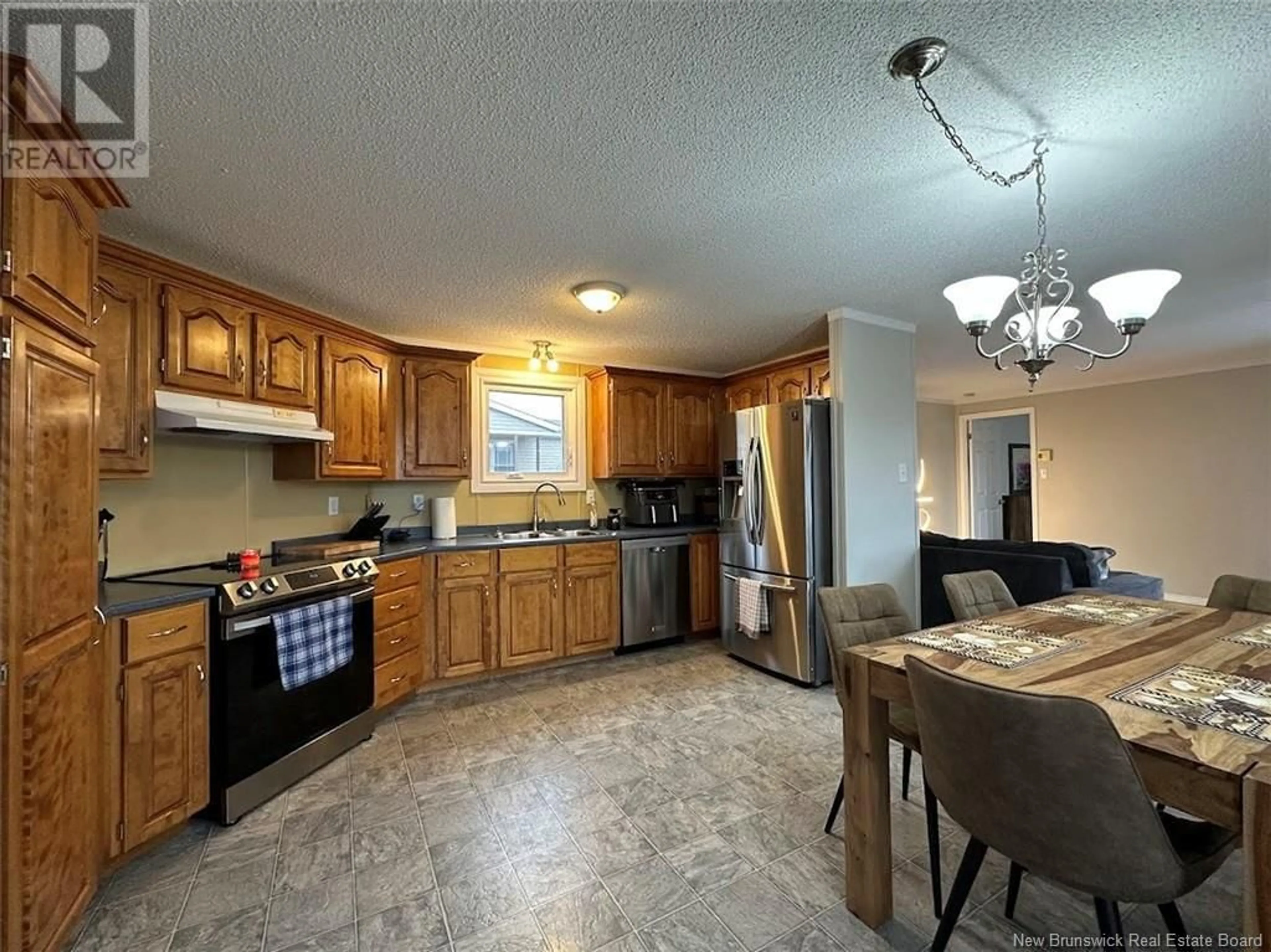 Open concept kitchen, ceramic/tile floor for 60 CARDINAL STREET, Edmundston New Brunswick E3V5E4