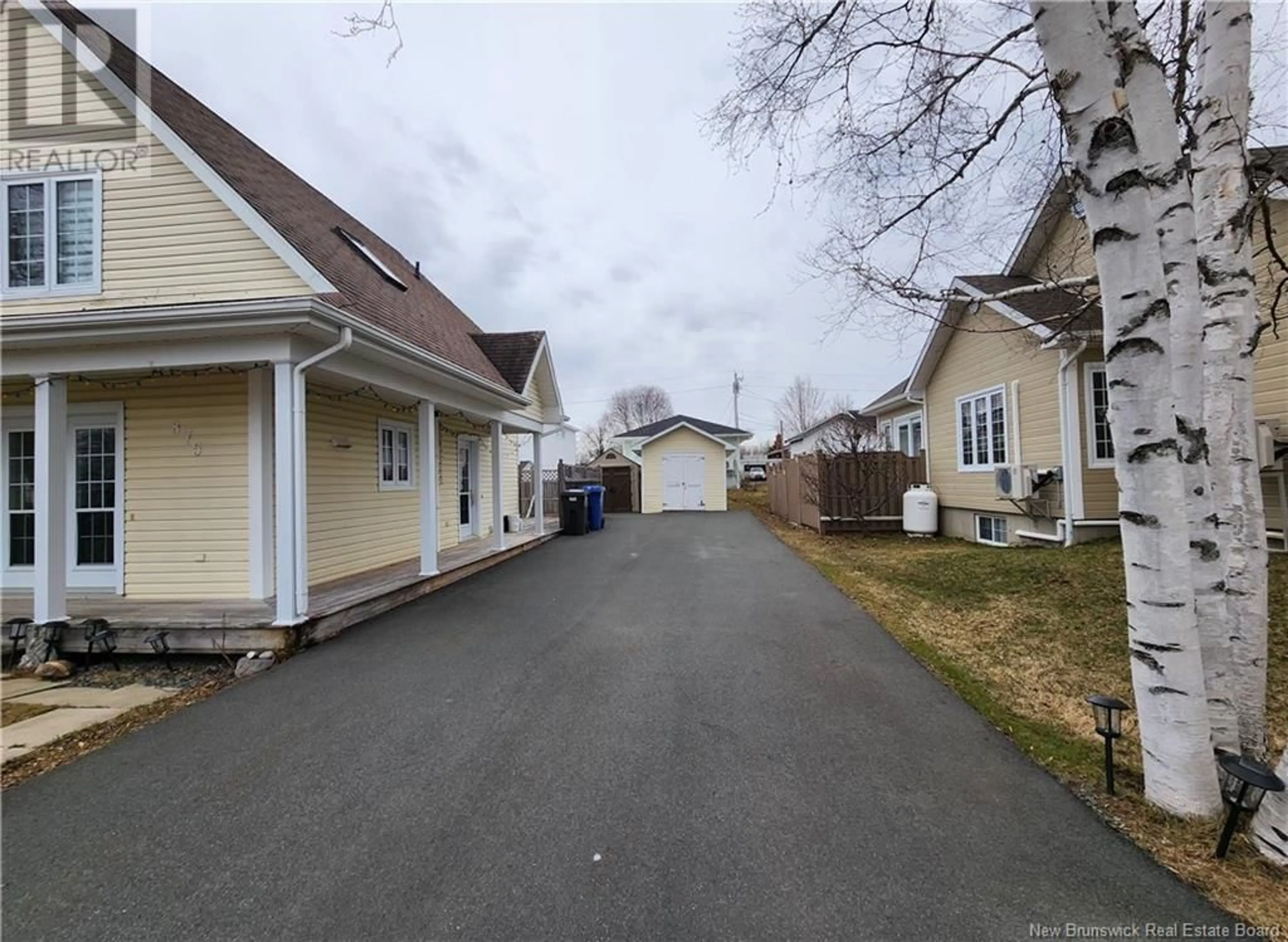 A pic from outside/outdoor area/front of a property/back of a property/a pic from drone, street for 875 ROUSSY, Bathurst New Brunswick E2A4W5