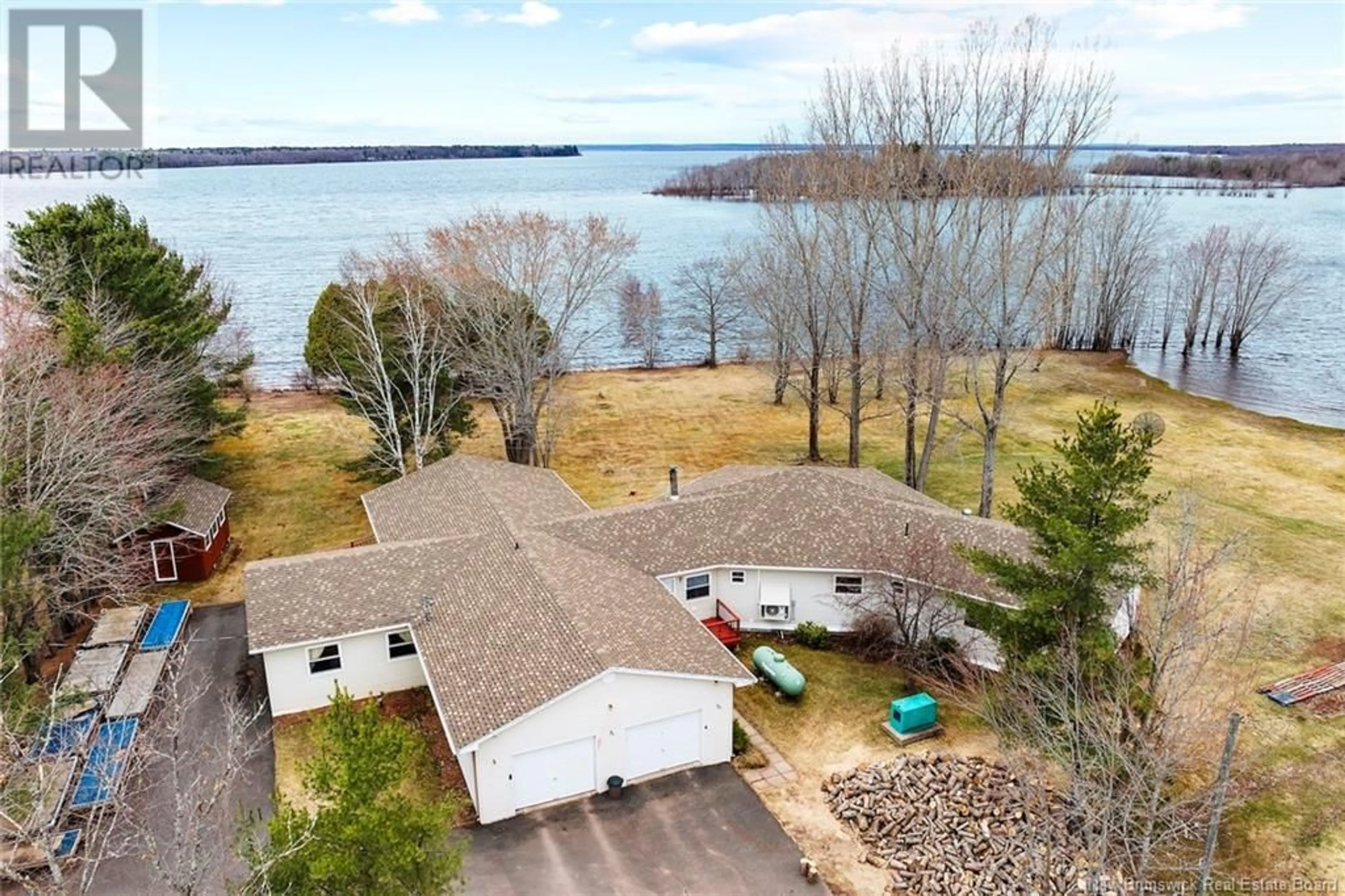 A pic from outside/outdoor area/front of a property/back of a property/a pic from drone, water/lake/river/ocean view for 38 SHORE ROAD, Clarks Corner New Brunswick E4B1R7