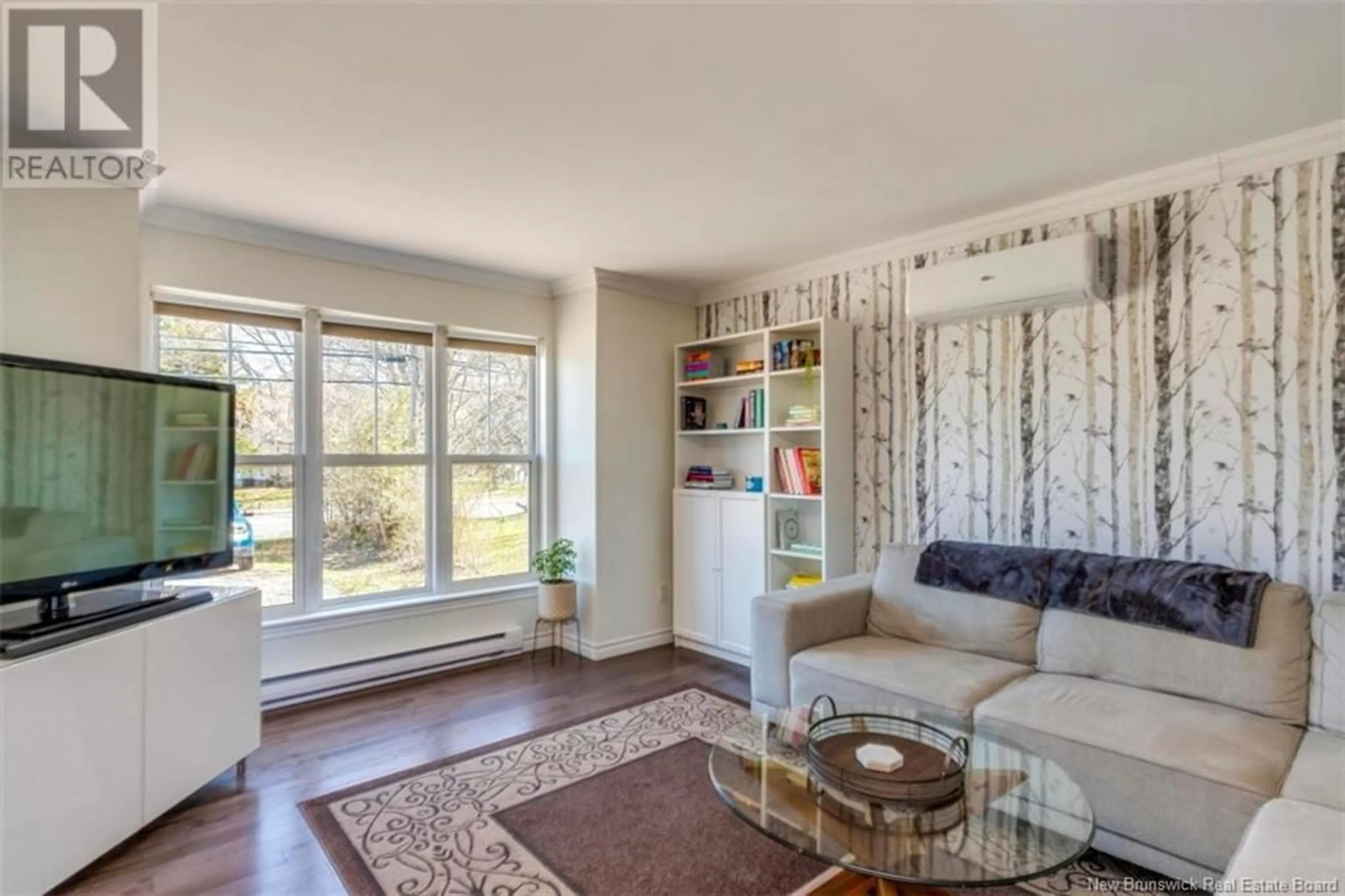 Living room with furniture, wood/laminate floor for 1019 SHEDIAC ROAD, Moncton New Brunswick E1A7B6