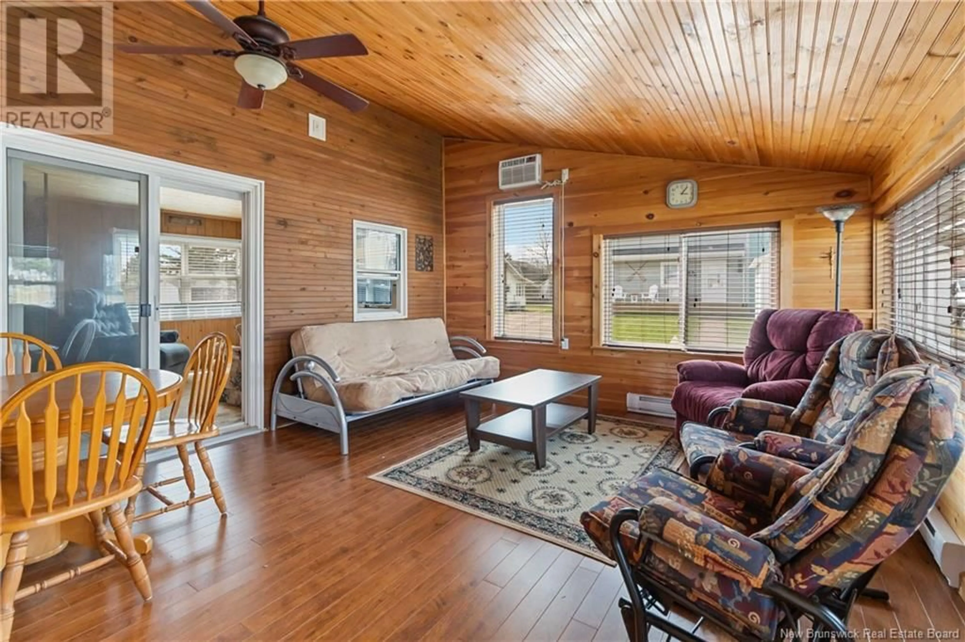 Living room with furniture, wood/laminate floor for 6 DE LA ROSE AVENUE, Cap Bimet New Brunswick E4P7E6