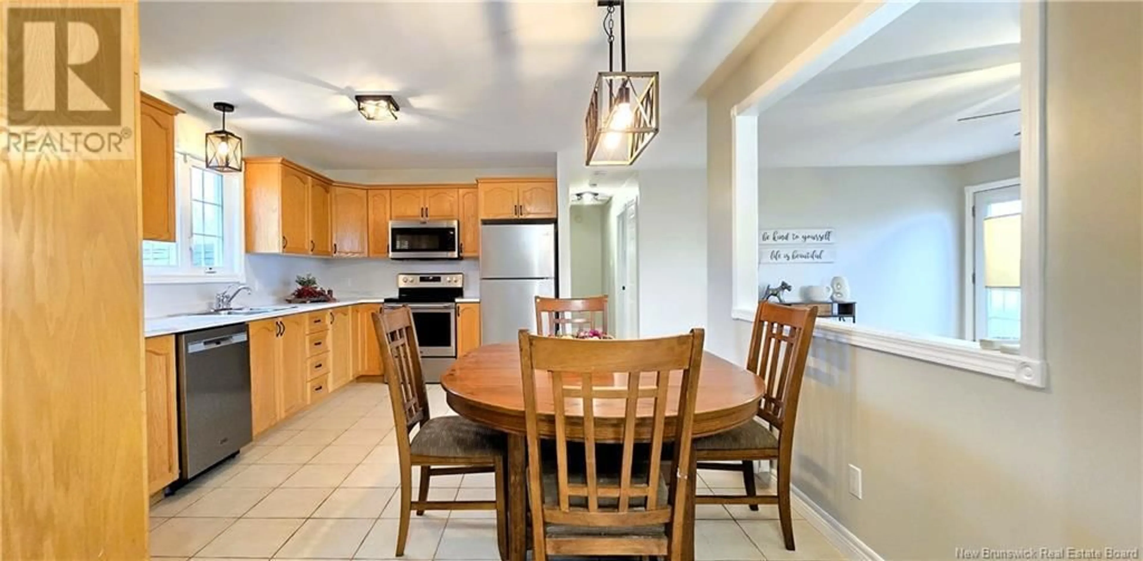 Open concept kitchen, ceramic/tile floor for 4185 BOUL DES FONDATEURS BOULEVARD, Saint-Isidore New Brunswick E8M1G7