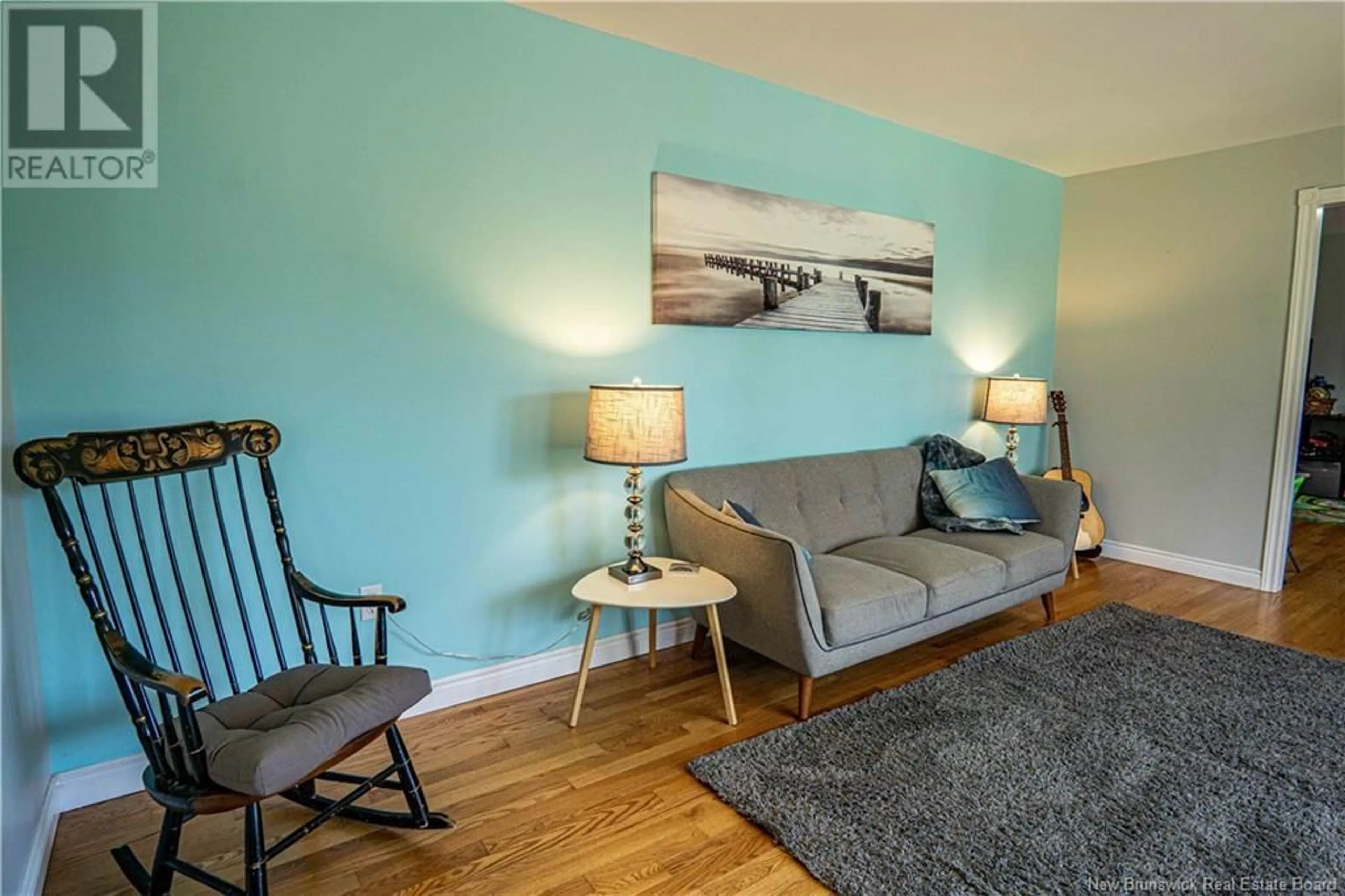 Living room with furniture, wood/laminate floor for 49 KAREN DRIVE, Rusagonis New Brunswick E3B7X4