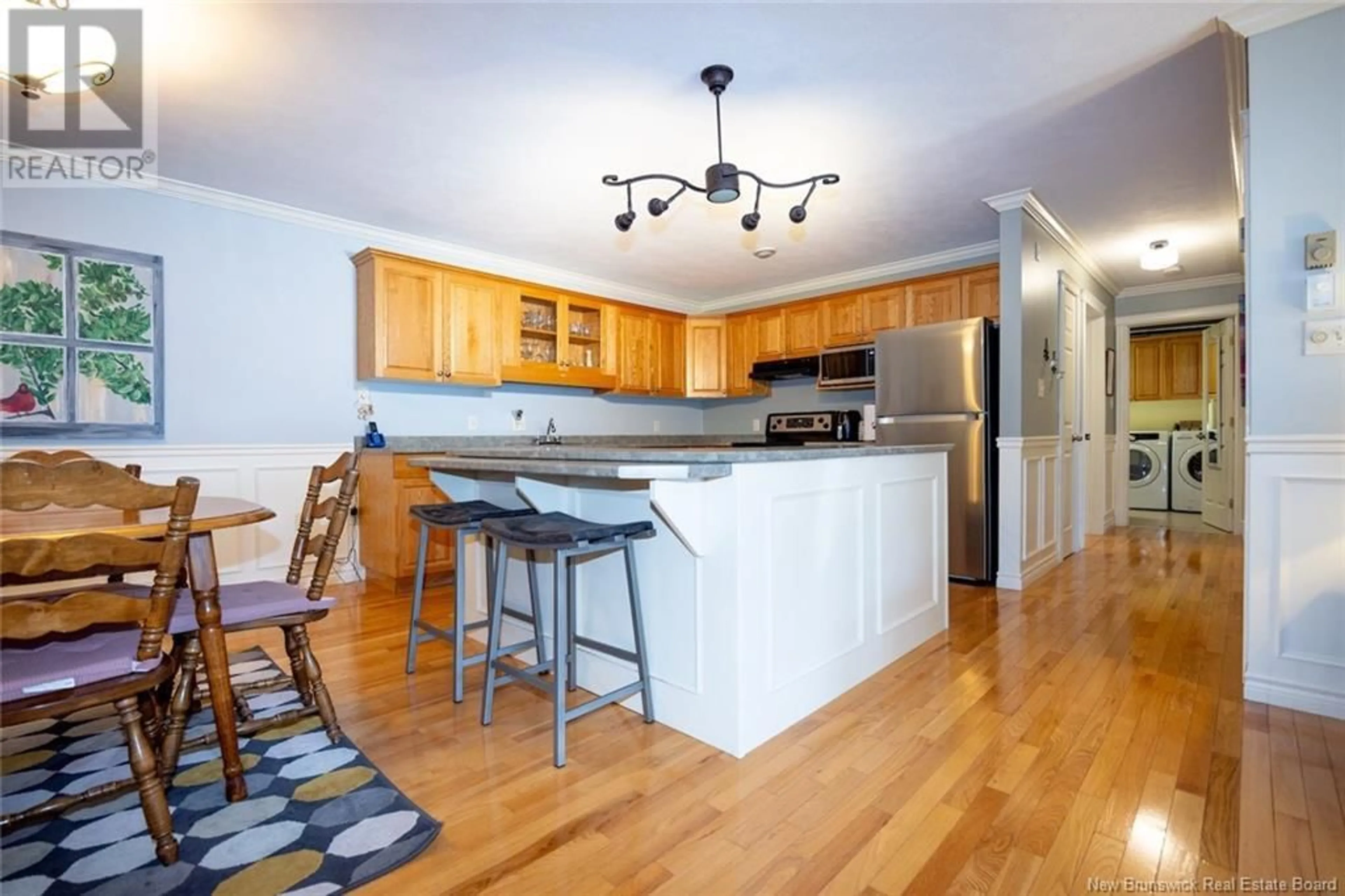 Open concept kitchen, wood/laminate floor for 6 - 175 REYNOLDS STREET, Fredericton New Brunswick E3A0H1