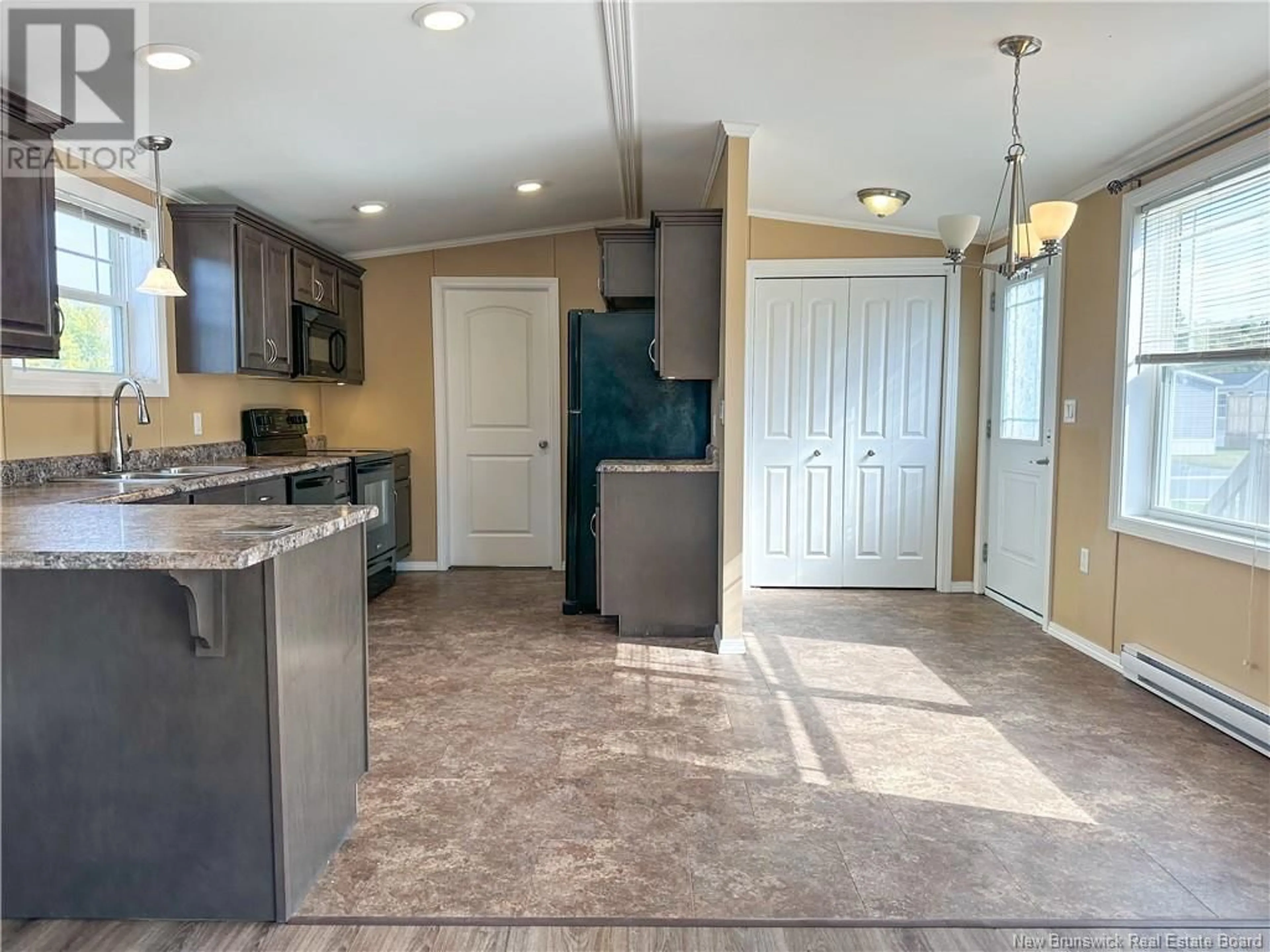 Open concept kitchen, ceramic/tile floor for 14 IVORY COURT, Woodstock New Brunswick E7M0G5