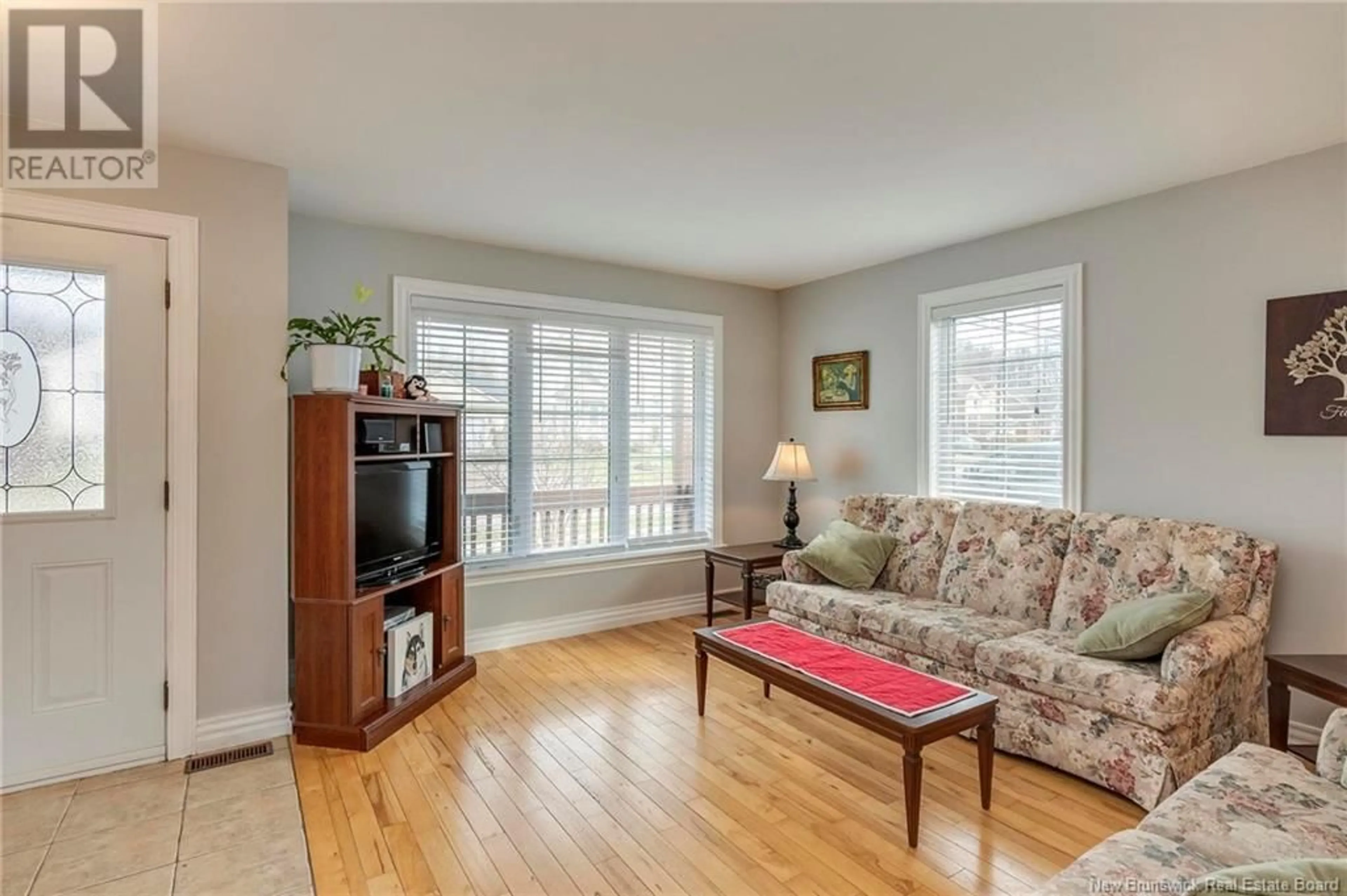Living room with furniture, wood/laminate floor for 80 SAVANNAH DRIVE, Moncton New Brunswick E1A0L1