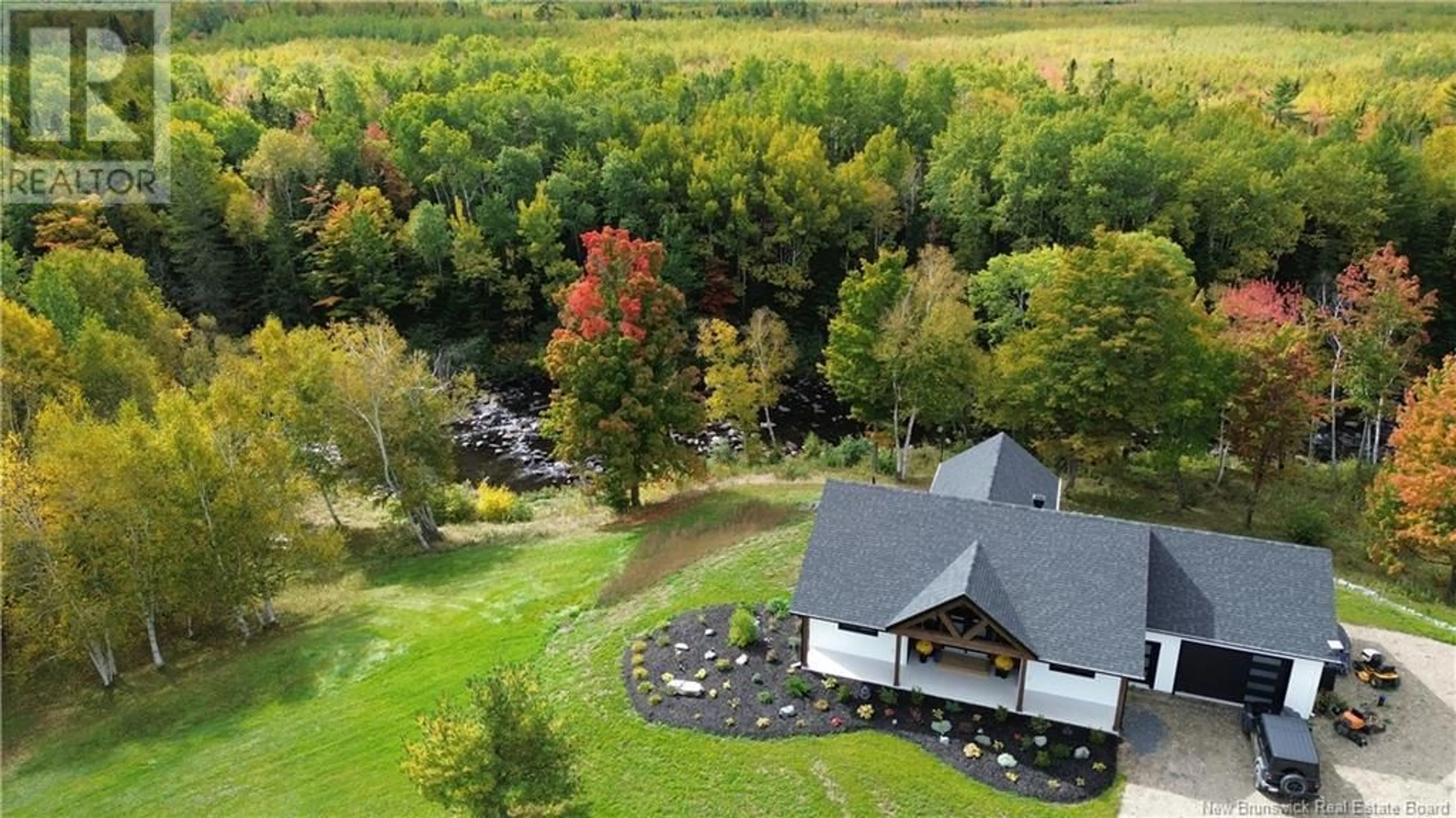 A pic from outside/outdoor area/front of a property/back of a property/a pic from drone, unknown for 1300 WEST DRIVE, Bathurst New Brunswick E2A0B4