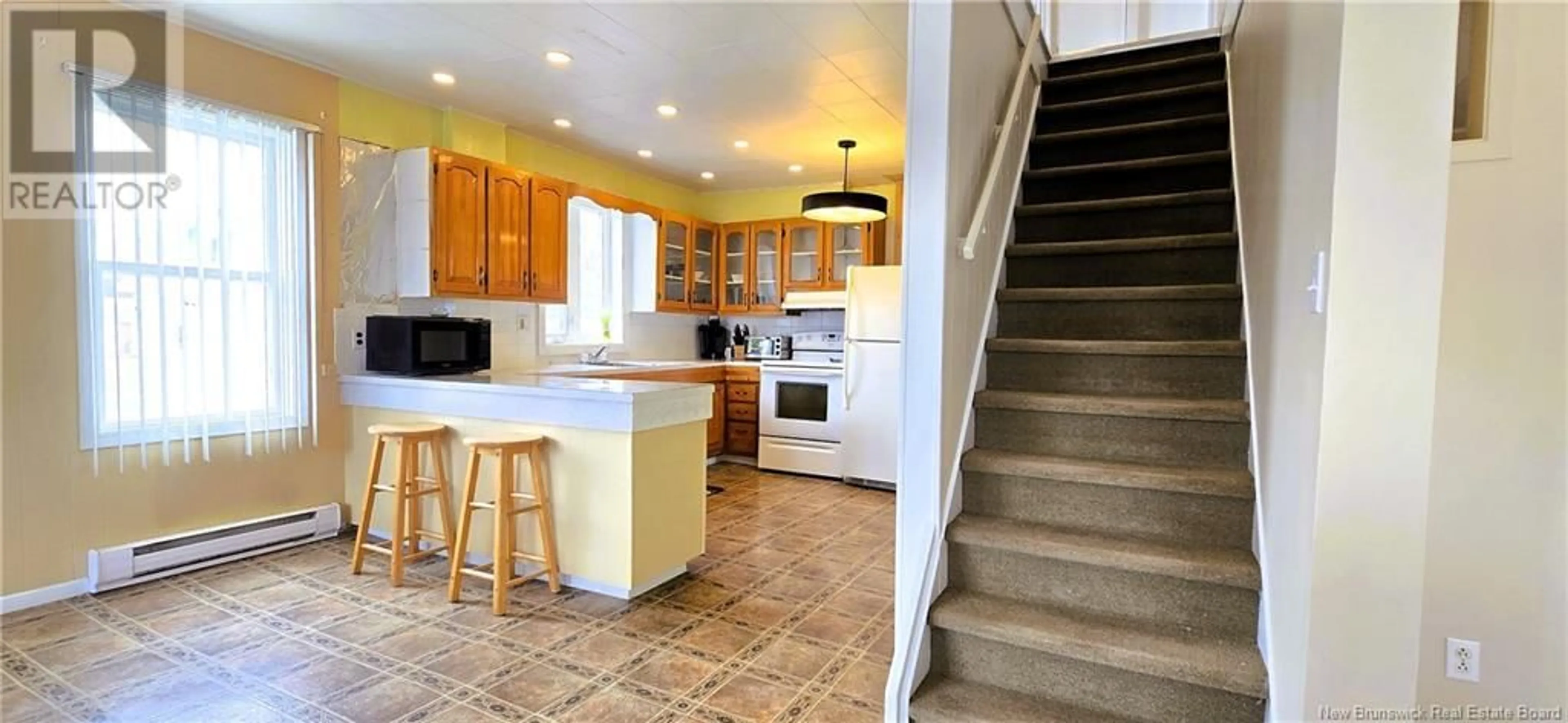 Open concept kitchen, ceramic/tile floor for 754 RUE PINET STREET, Bertrand New Brunswick E1W1L6