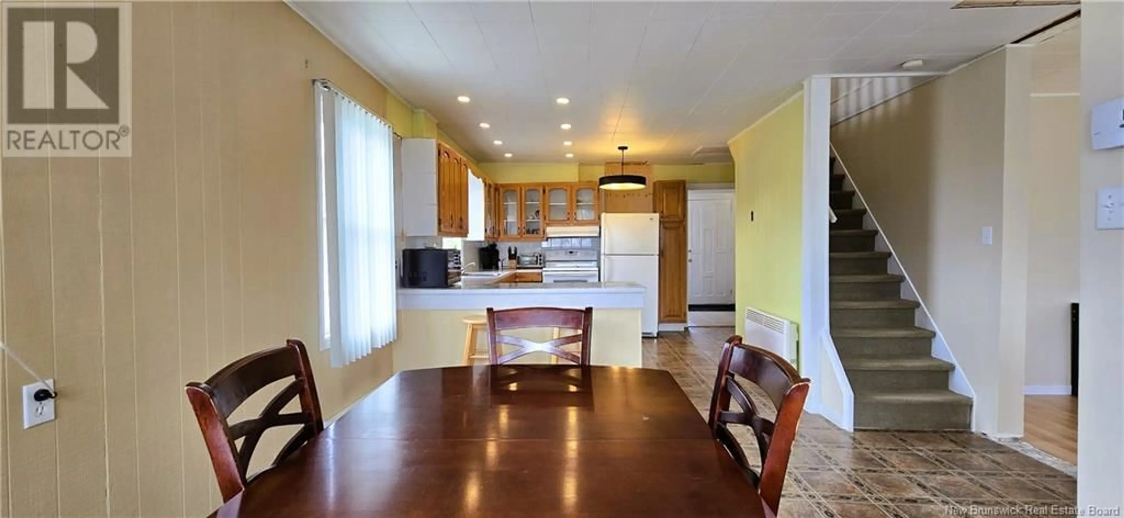 Open concept kitchen, wood/laminate floor for 754 RUE PINET STREET, Bertrand New Brunswick E1W1L6