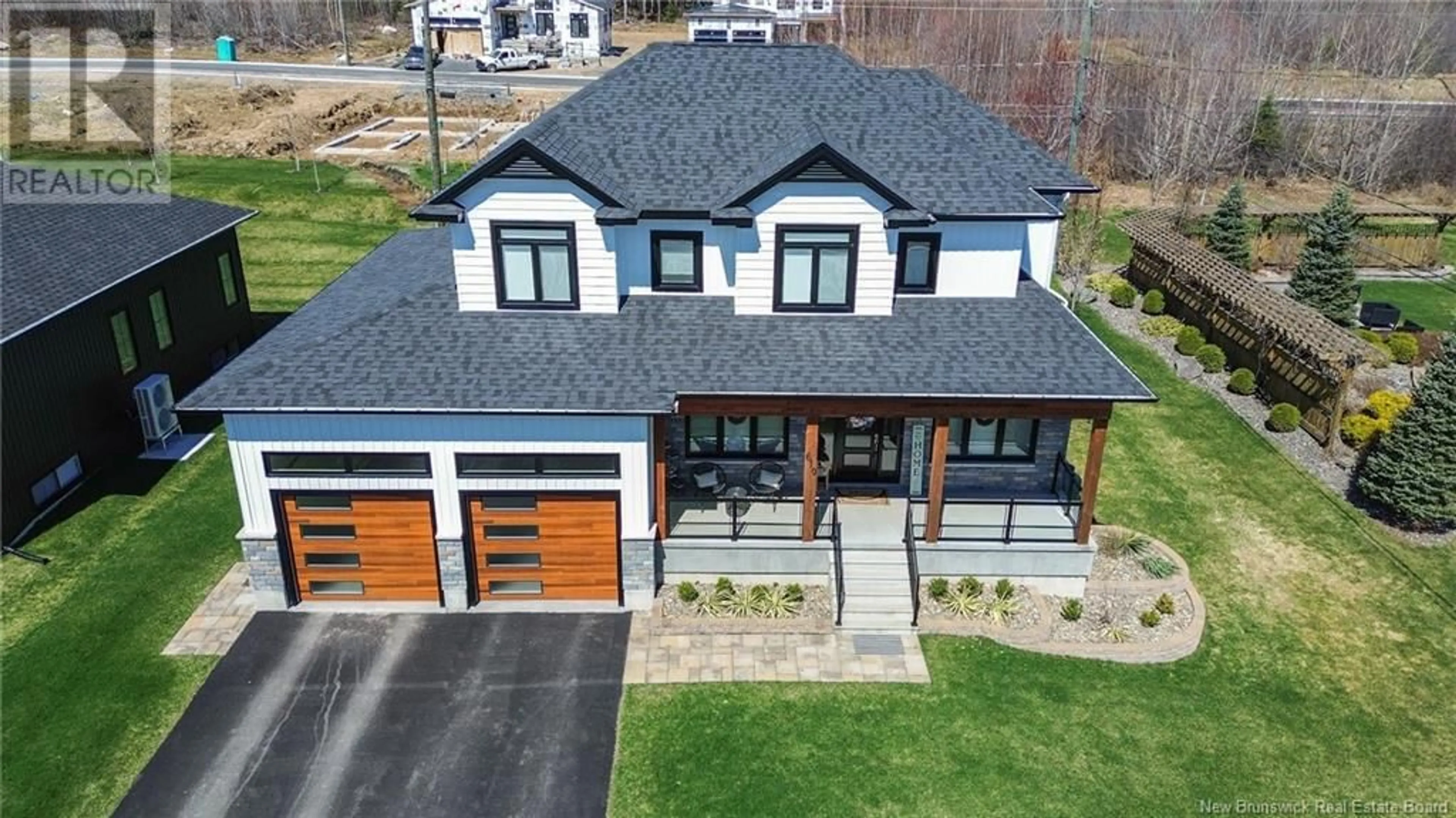 A pic from outside/outdoor area/front of a property/back of a property/a pic from drone, street for 610 WETMORE ROAD, Fredericton New Brunswick E3B0W6