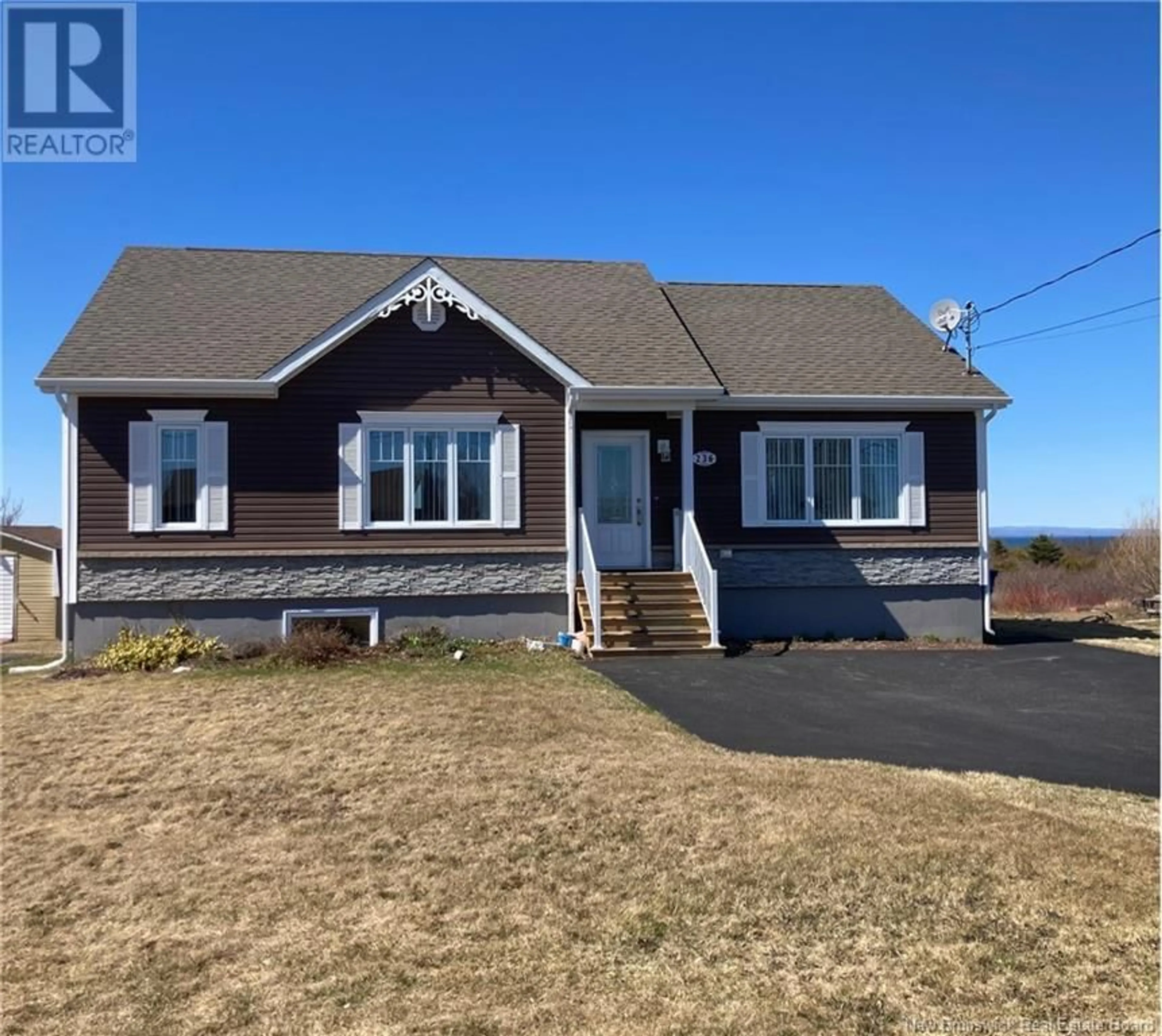 Home with vinyl exterior material, street for 236 RUE ACADIE STREET, Grande-Anse New Brunswick E8N1B3