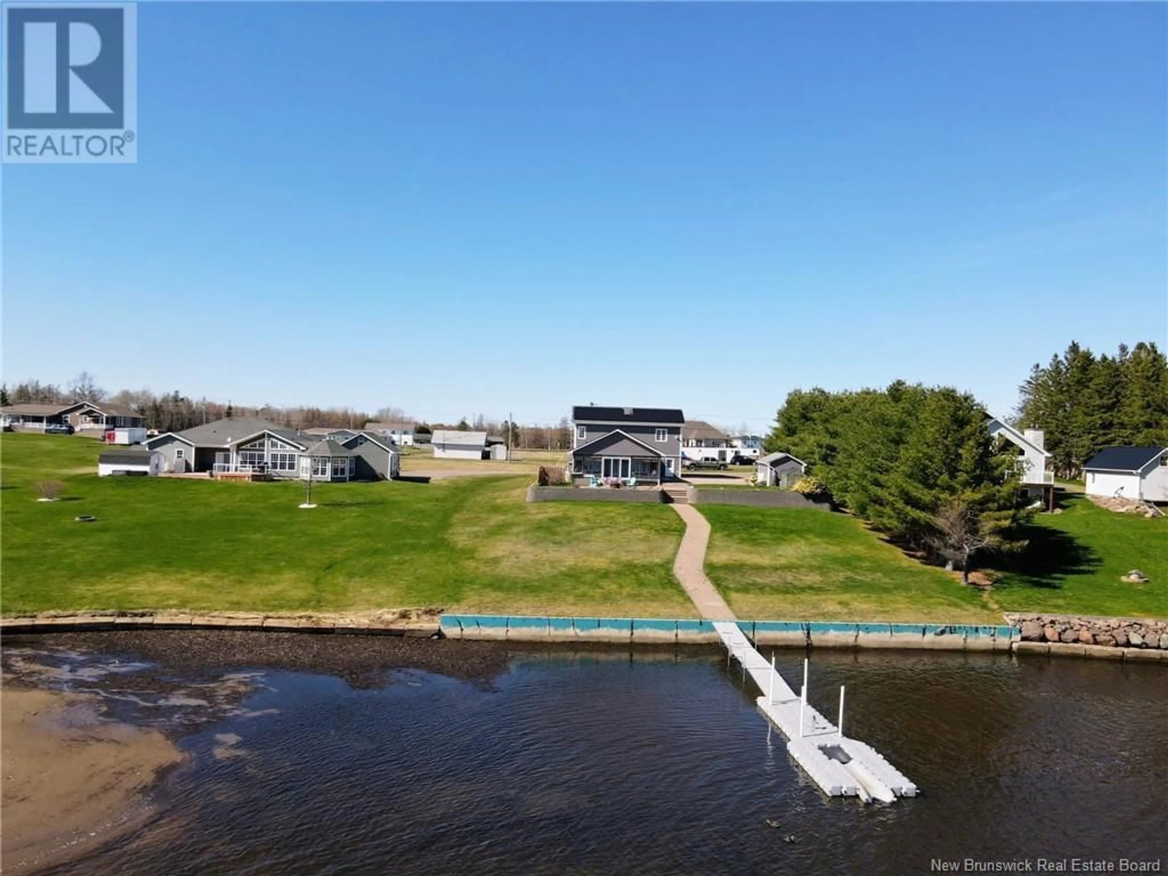 A pic from outside/outdoor area/front of a property/back of a property/a pic from drone, water/lake/river/ocean view for 50 MITTON ROAD, Cocagne New Brunswick E4R2V1