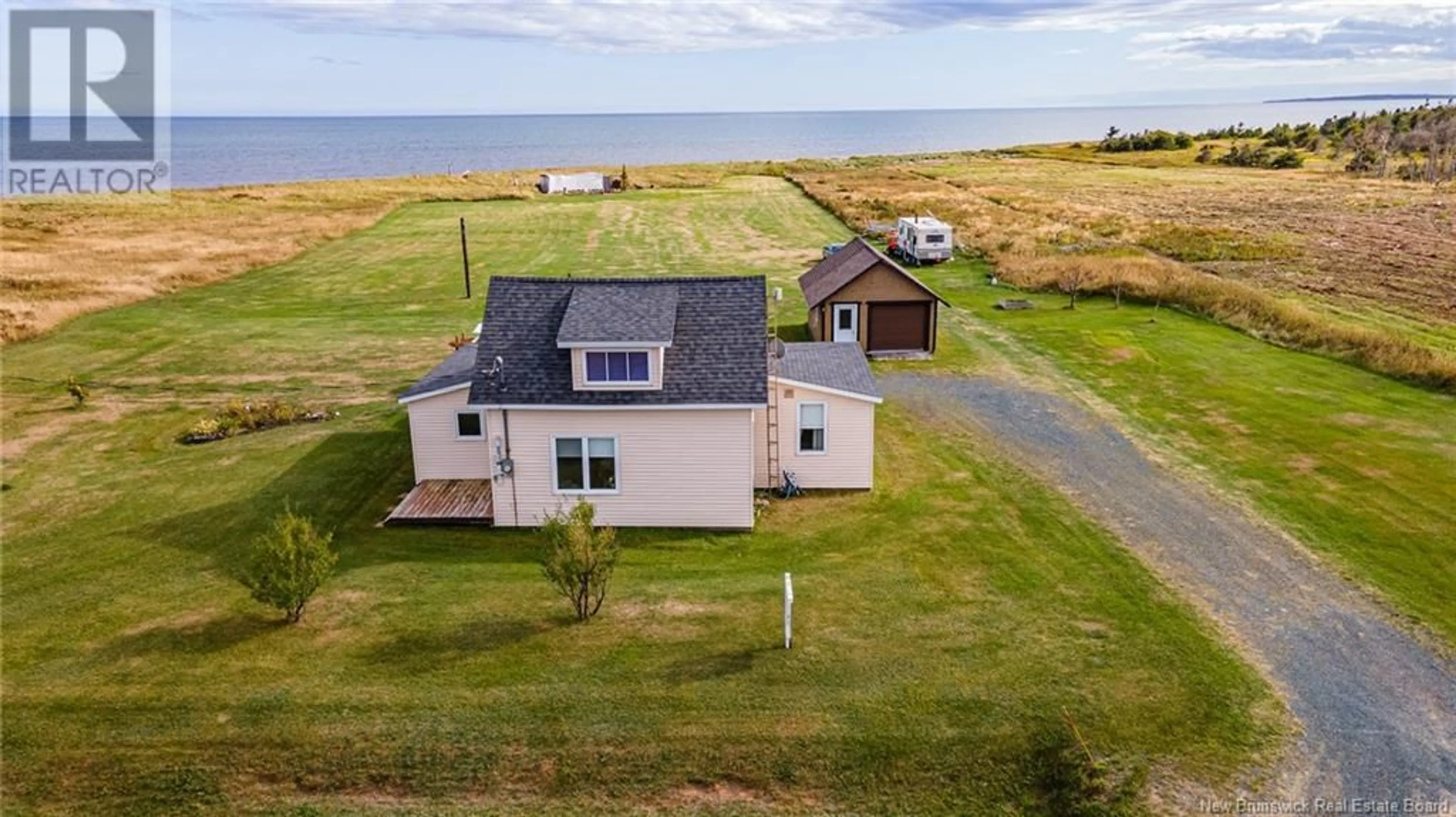 A pic from outside/outdoor area/front of a property/back of a property/a pic from drone, water/lake/river/ocean view for 1645 CH. WILSON POINT, Miscou New Brunswick E8T2G8