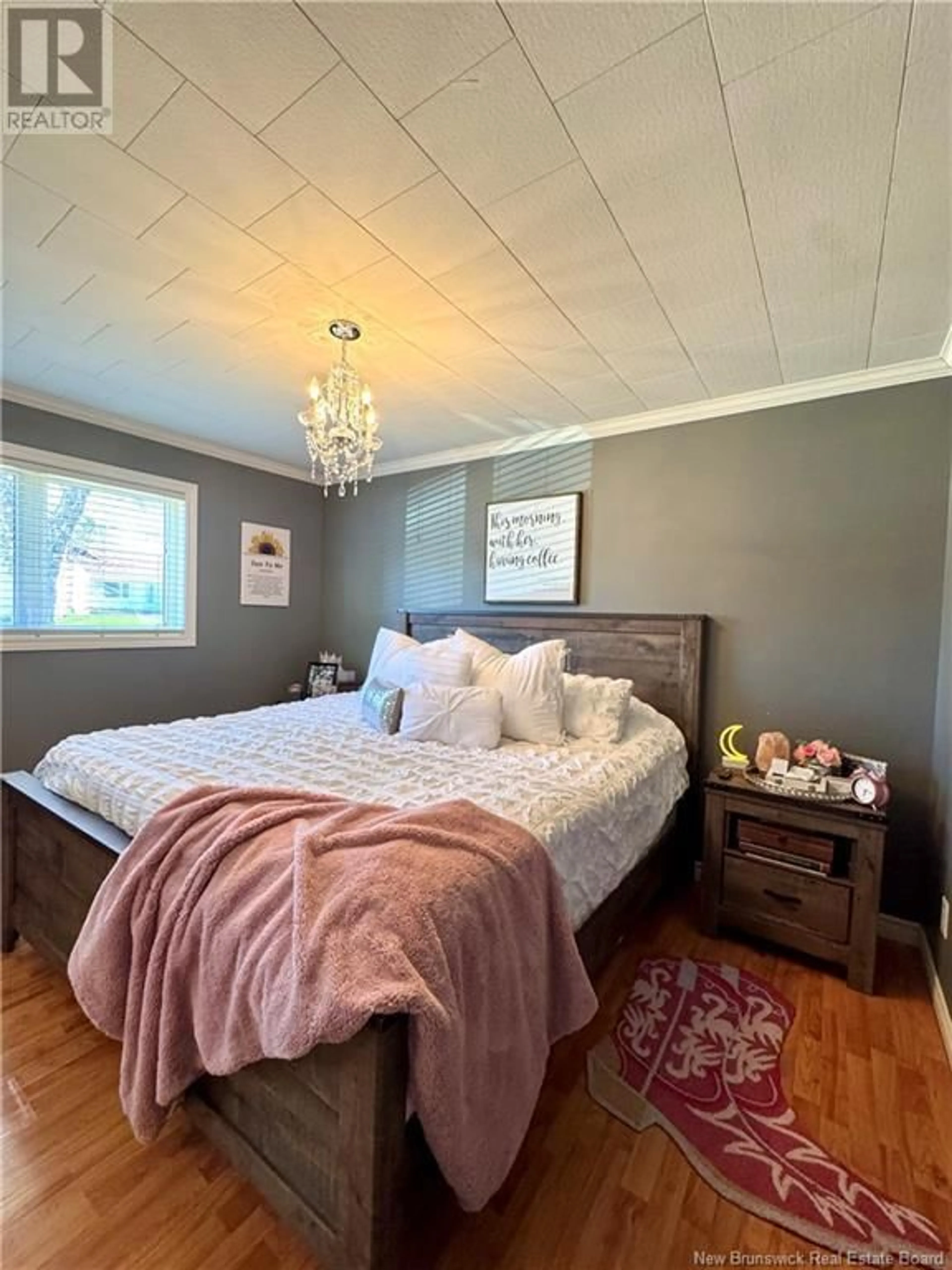 Bedroom with bed, wood/laminate floor for 302 KING GEORGE HWY, Miramichi New Brunswick E1V1K9
