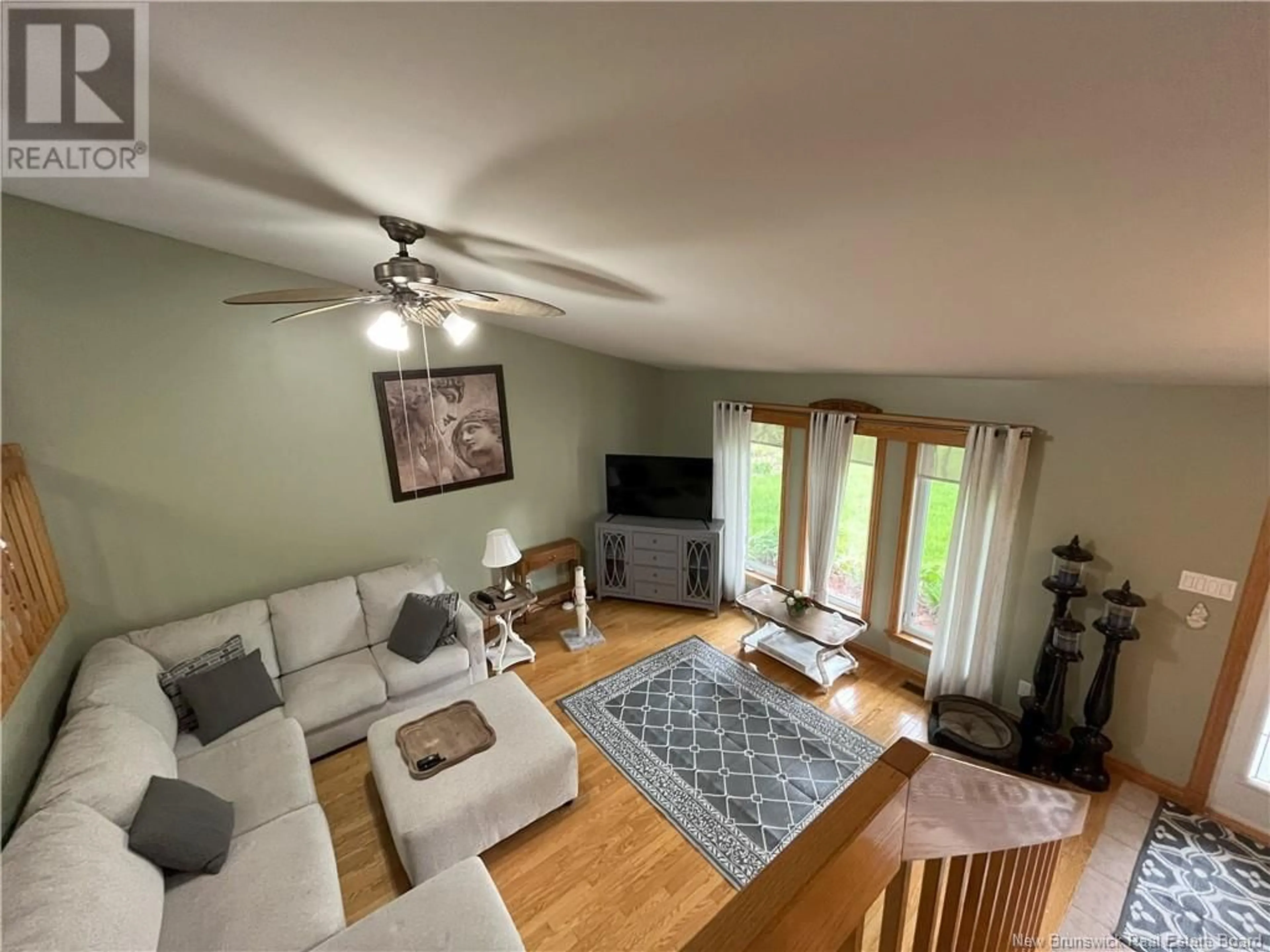 Living room with furniture, wood/laminate floor for 674 BAISLEY ROAD, Saint-Jacques New Brunswick E7B1Z7