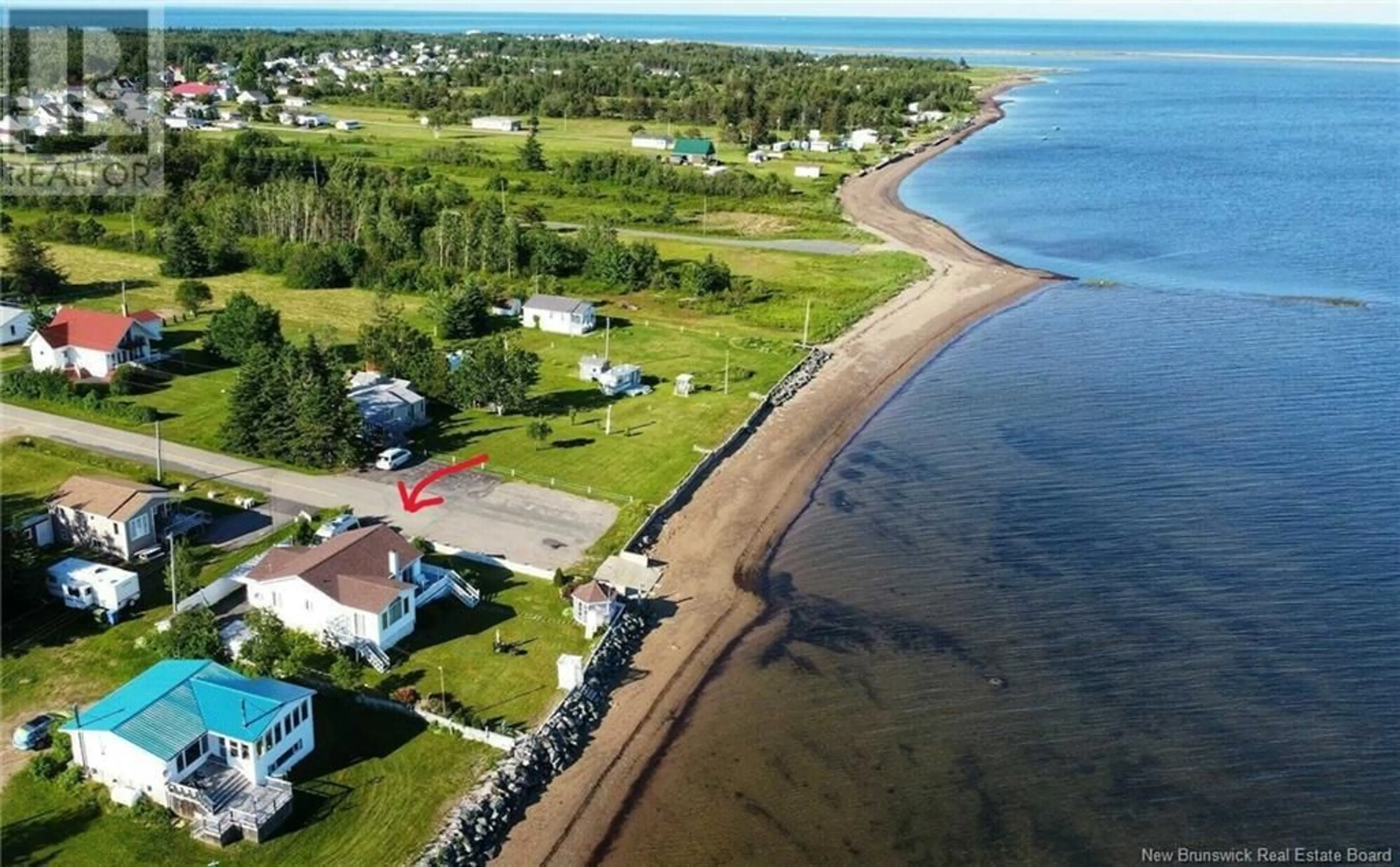 A pic from outside/outdoor area/front of a property/back of a property/a pic from drone, water/lake/river/ocean view for 52 RUE BLANCHARD, Maisonnette New Brunswick E8N1W1