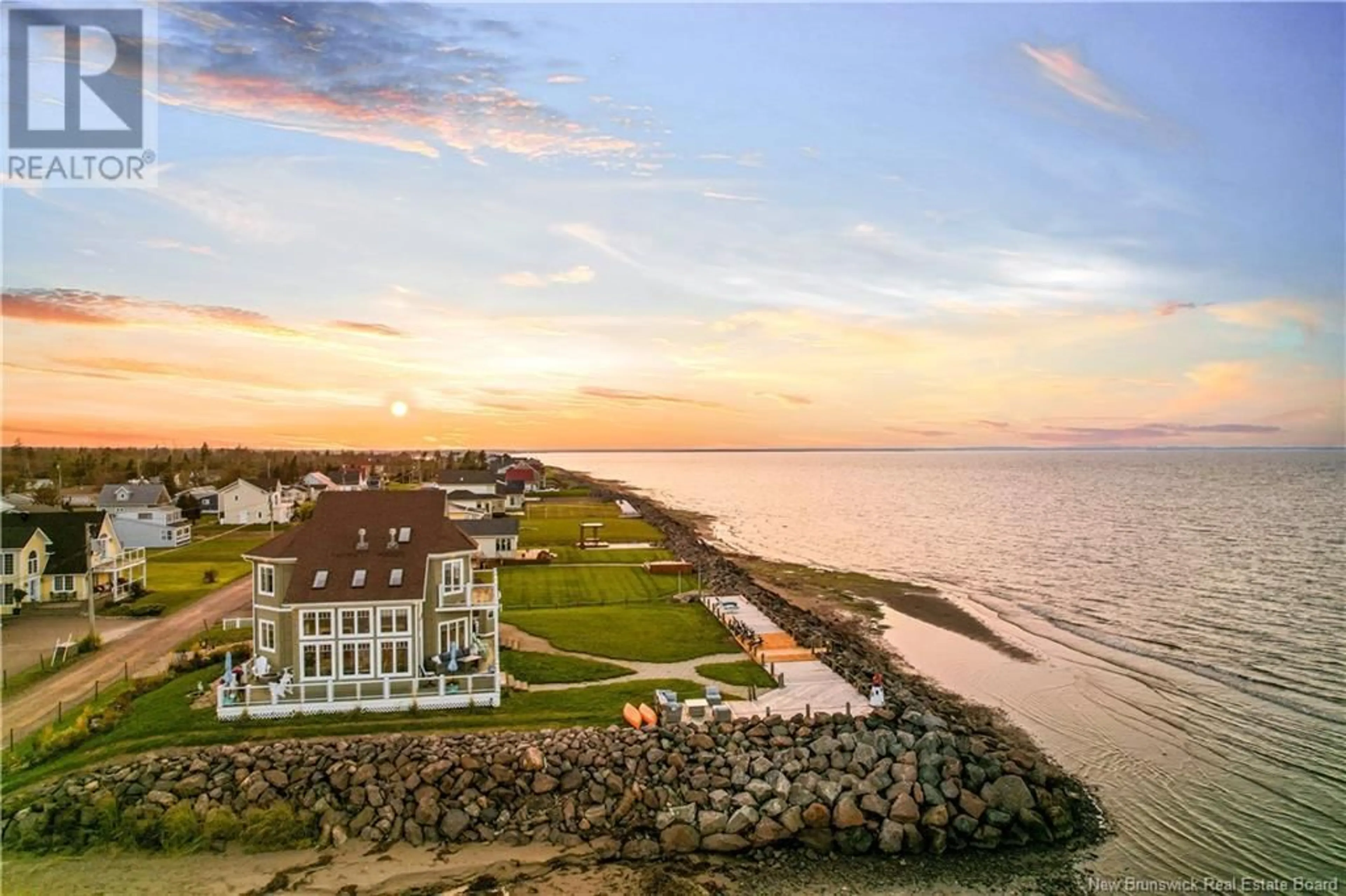 A pic from outside/outdoor area/front of a property/back of a property/a pic from drone, water/lake/river/ocean view for 56 SUR L'OCEAN STREET, Barachois New Brunswick E4P7Z9