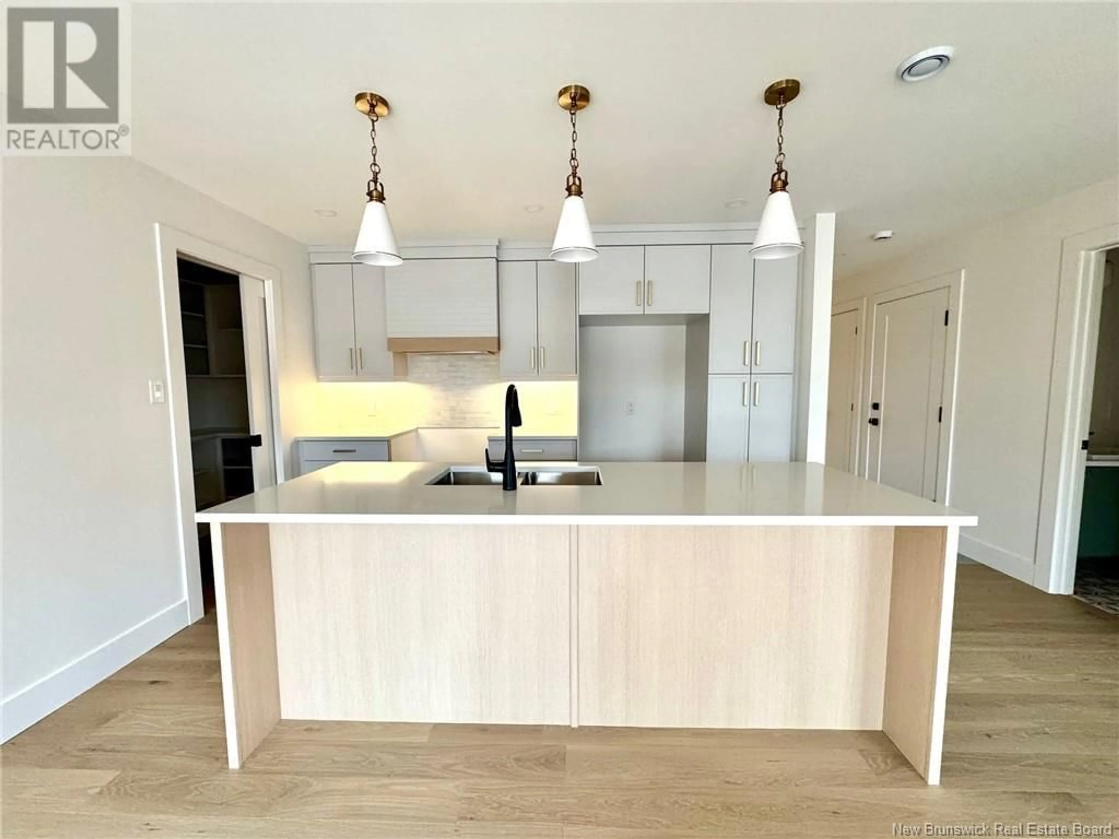 Open concept kitchen, wood/laminate floor for 75 ROSENBURG STREET, Moncton New Brunswick E1G6E9