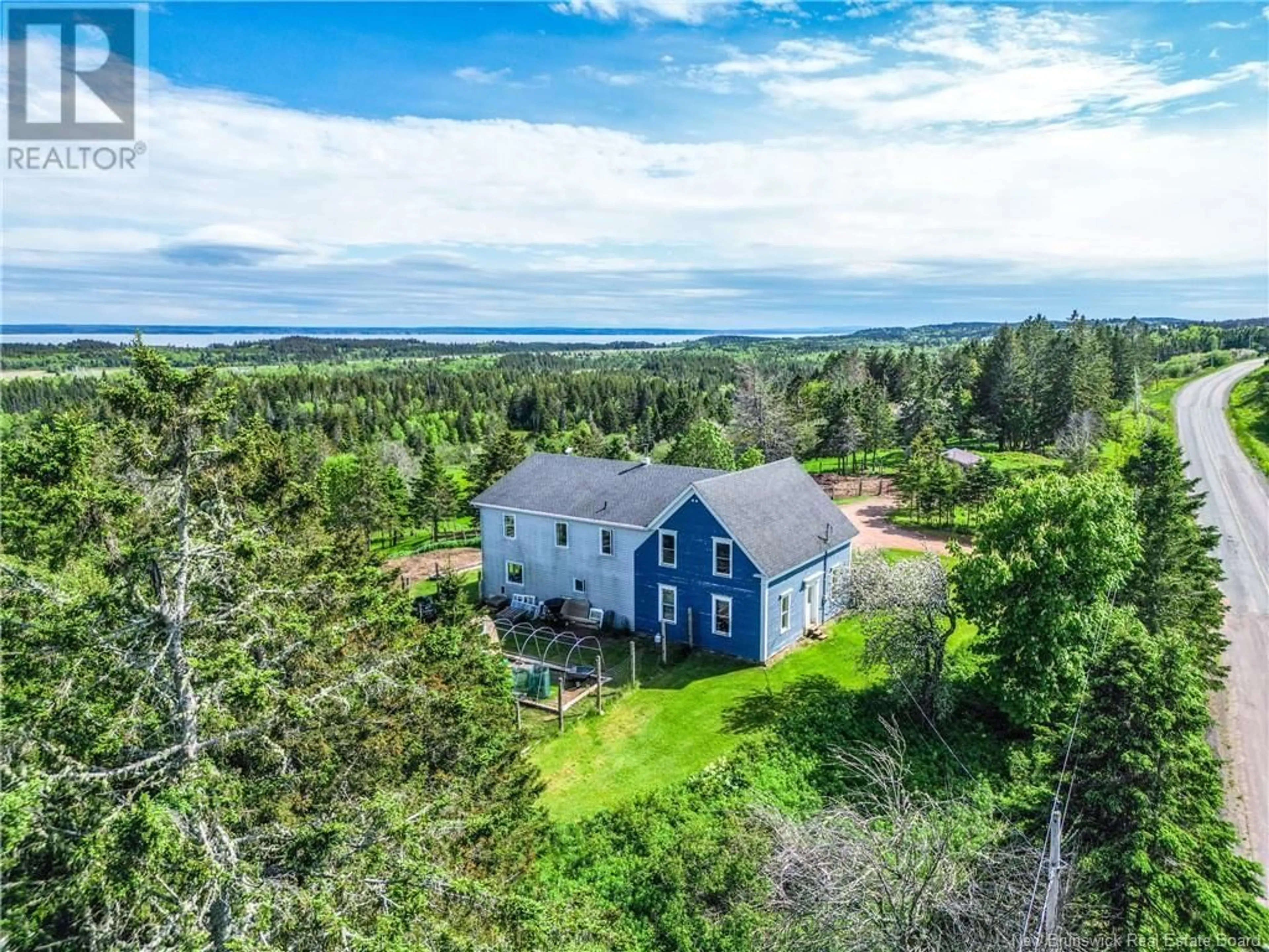 A pic from outside/outdoor area/front of a property/back of a property/a pic from drone, water/lake/river/ocean view for 899 ROUTE 915, New Horton New Brunswick E4H3S9