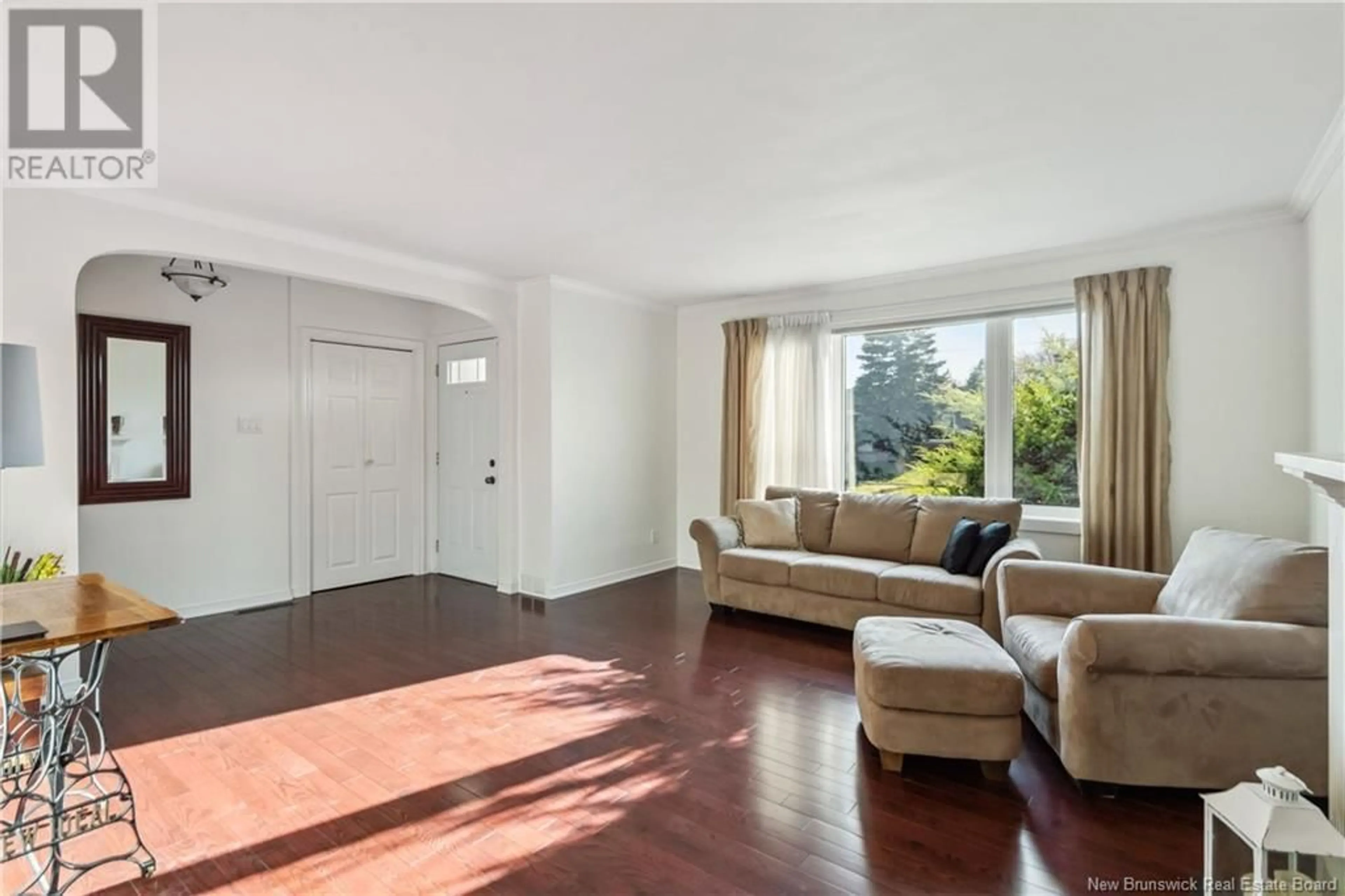 Living room with furniture, wood/laminate floor for 75 CENTURY DRIVE, Moncton New Brunswick E1E2X8