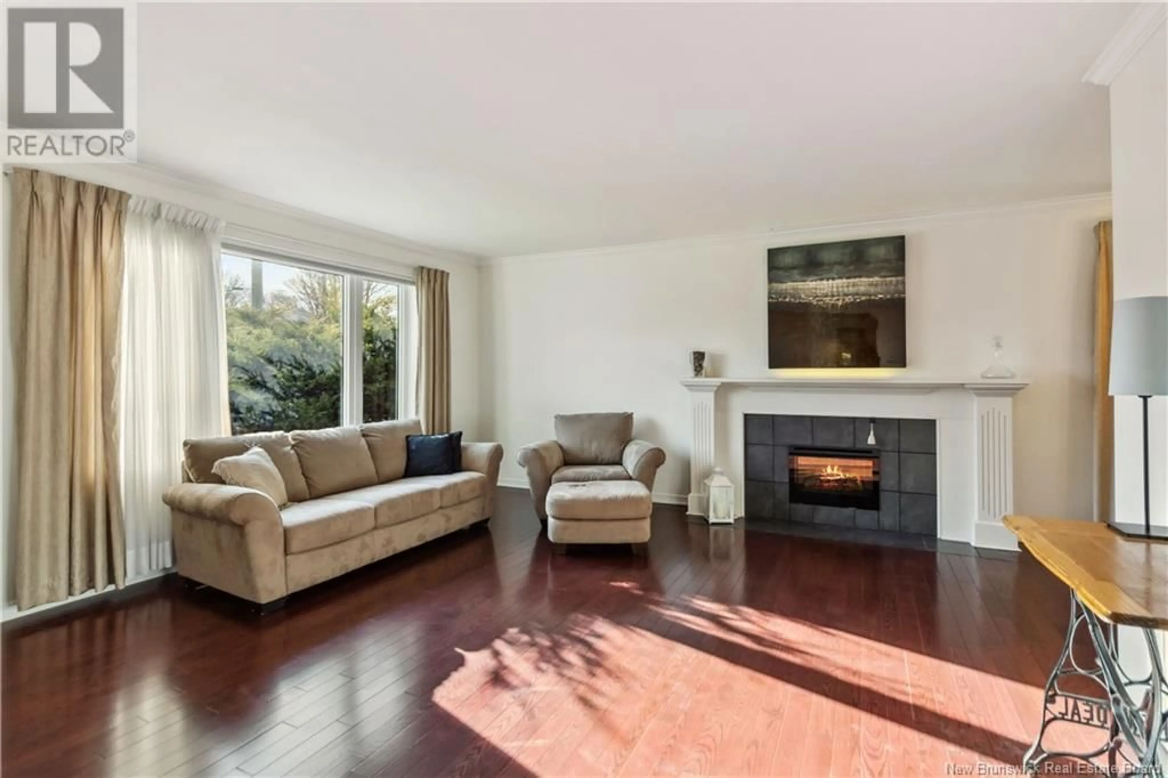 Living room with furniture, wood/laminate floor for 75 CENTURY DRIVE, Moncton New Brunswick E1E2X8