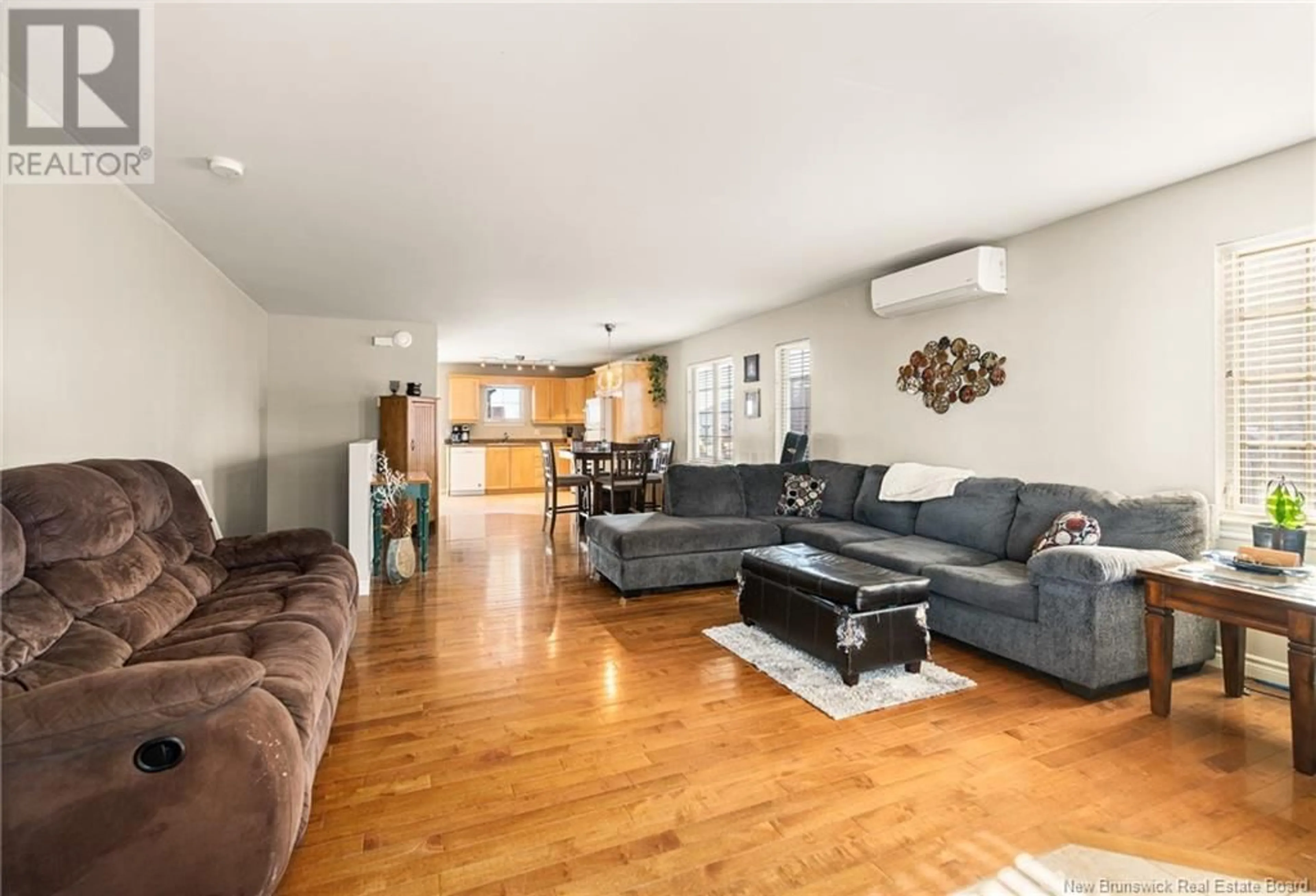 Living room with furniture, wood/laminate floor for 836 BERNARD STREET, Dieppe New Brunswick E1A5A4