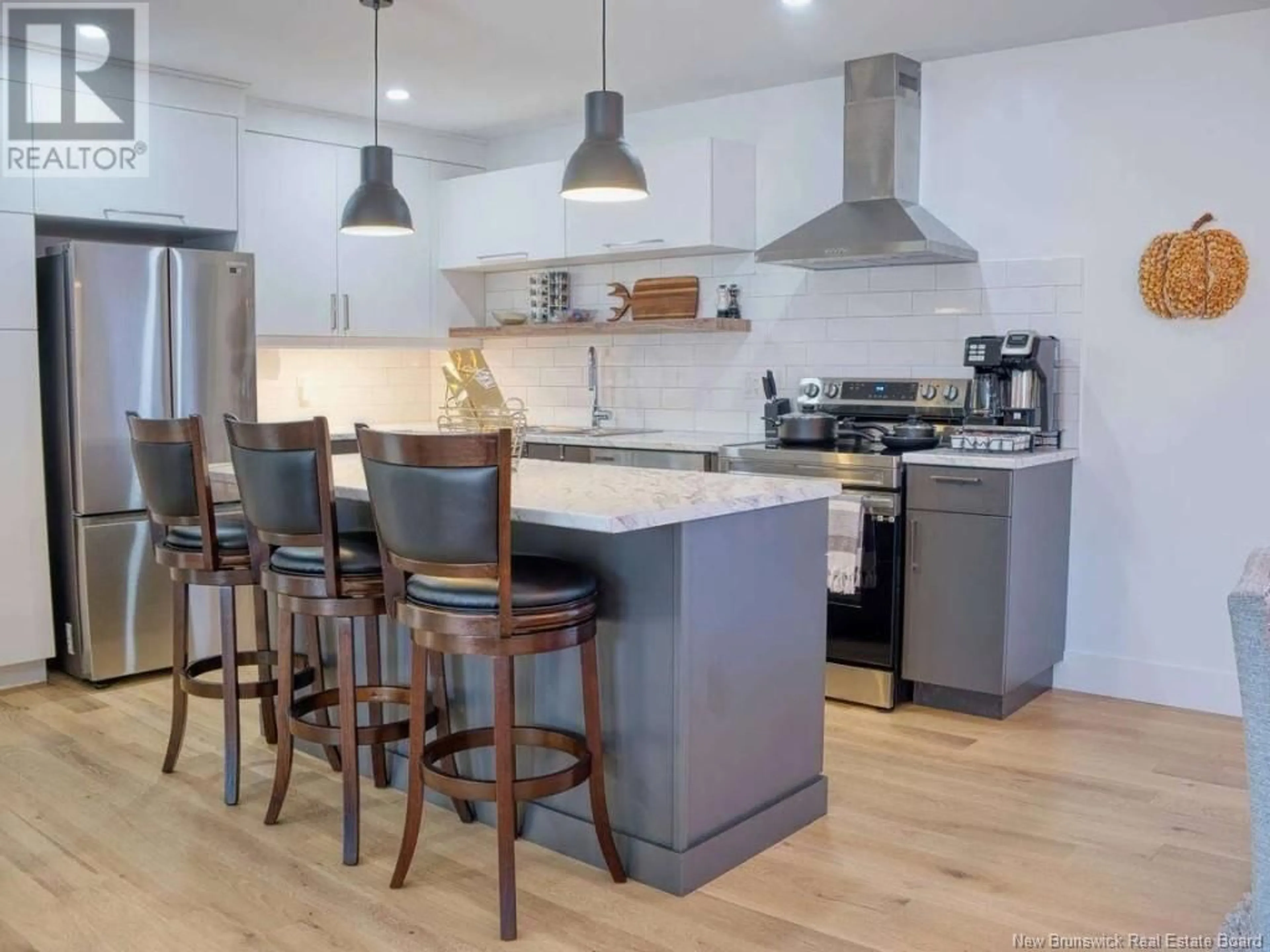 Open concept kitchen, wood/laminate floor for 116 NEWCOMBE DRIVE, Moncton New Brunswick E1A9V4