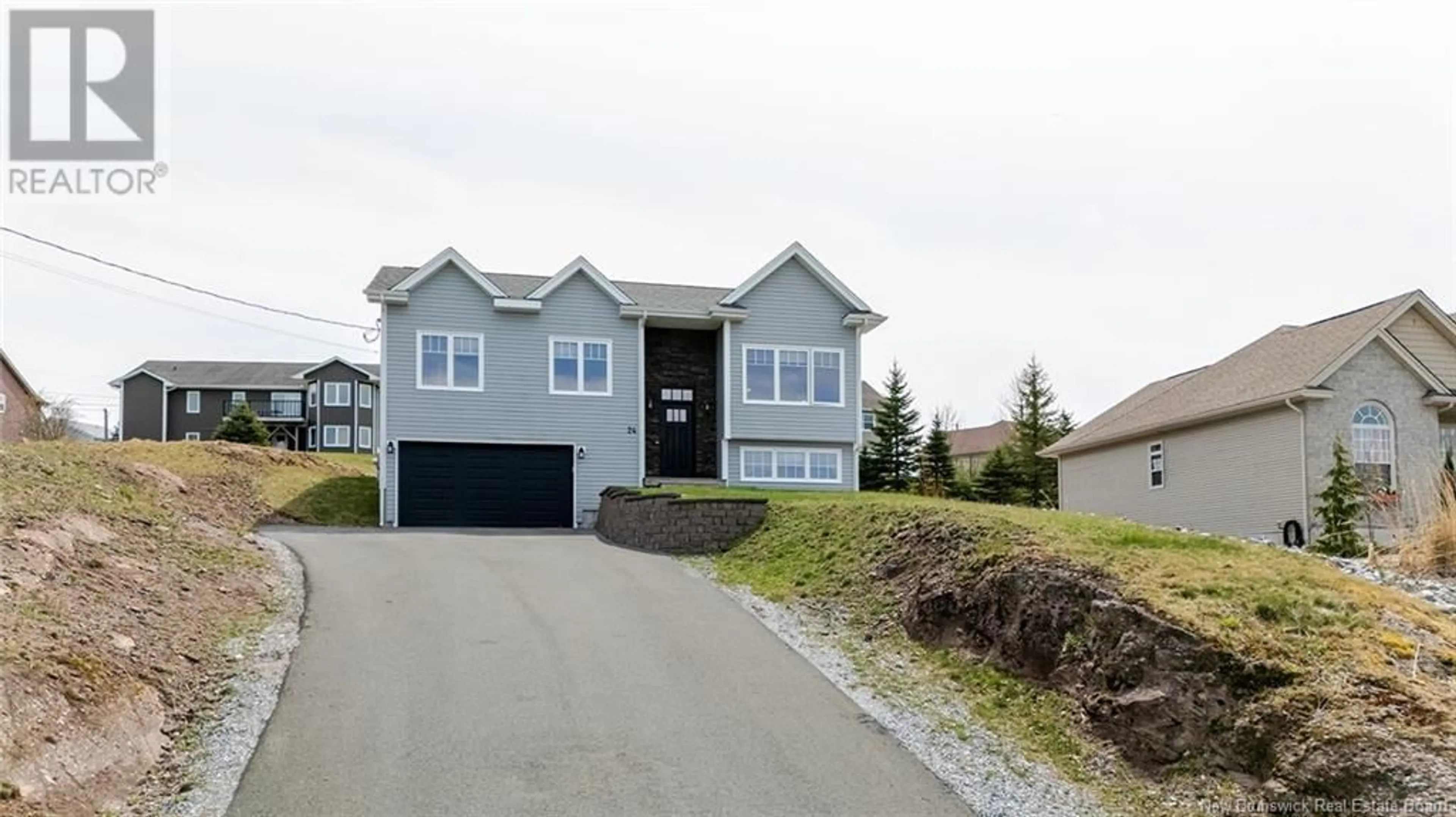 Home with vinyl exterior material, street for 24 MINSTREL DRIVE, Quispamsis New Brunswick E2E1S5