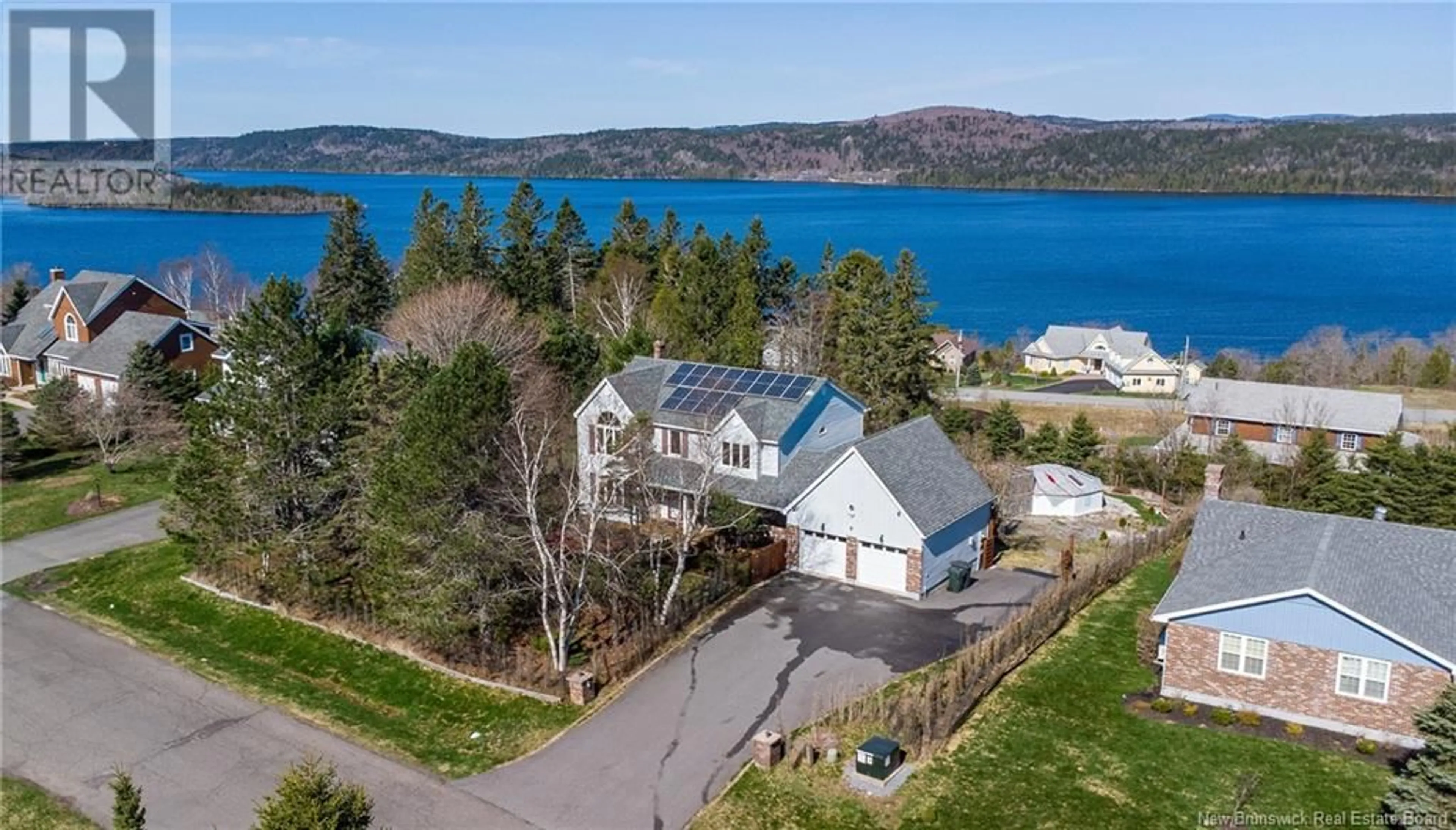 A pic from outside/outdoor area/front of a property/back of a property/a pic from drone, water/lake/river/ocean view for 6 RIVERCREST DRIVE, Quispamsis New Brunswick E2E1W4