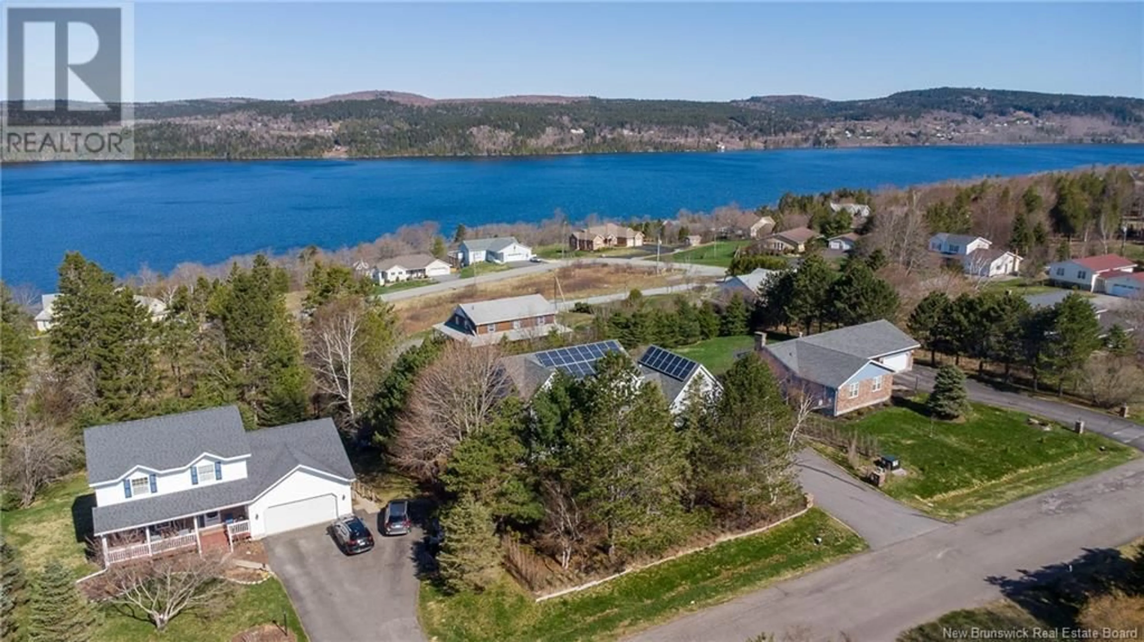 A pic from outside/outdoor area/front of a property/back of a property/a pic from drone, water/lake/river/ocean view for 6 RIVERCREST DRIVE, Quispamsis New Brunswick E2E1W4