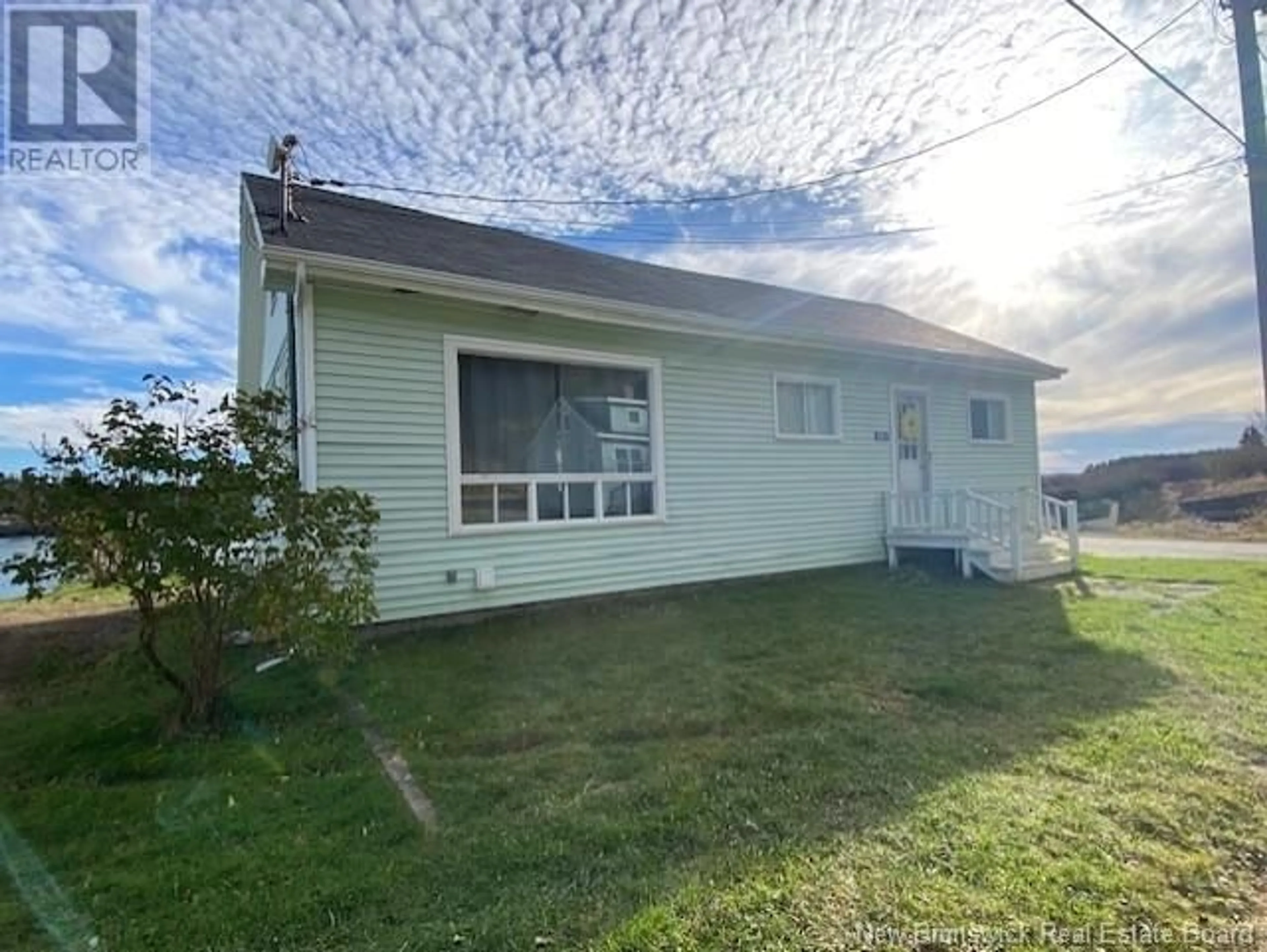 A pic from outside/outdoor area/front of a property/back of a property/a pic from drone, street for 521 WELLINGTON ROAD, Blacks Harbour New Brunswick E5H1C7