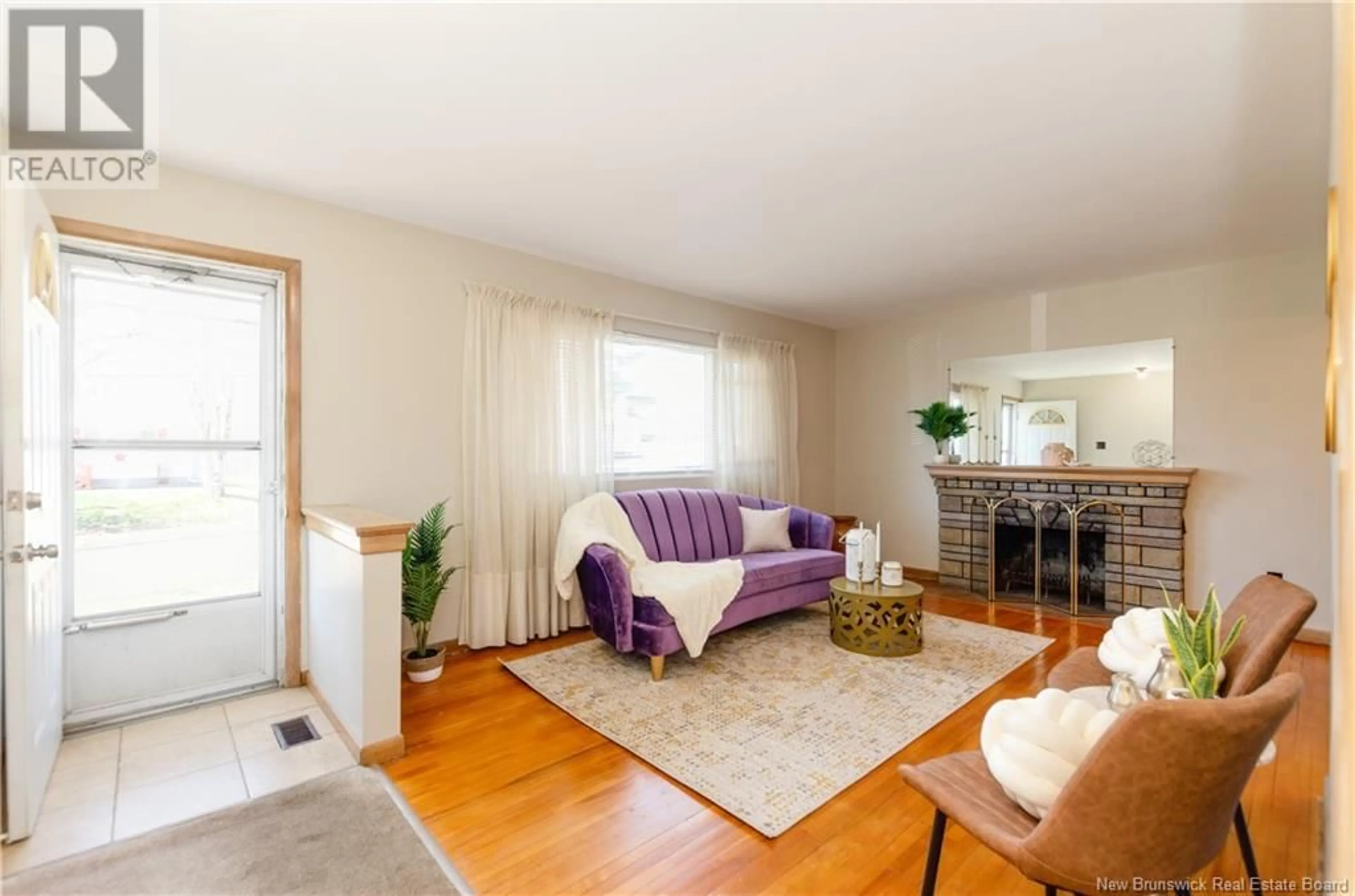 Living room with furniture, wood/laminate floor for 49 BISSETT AVENUE, Moncton New Brunswick E1E2S8