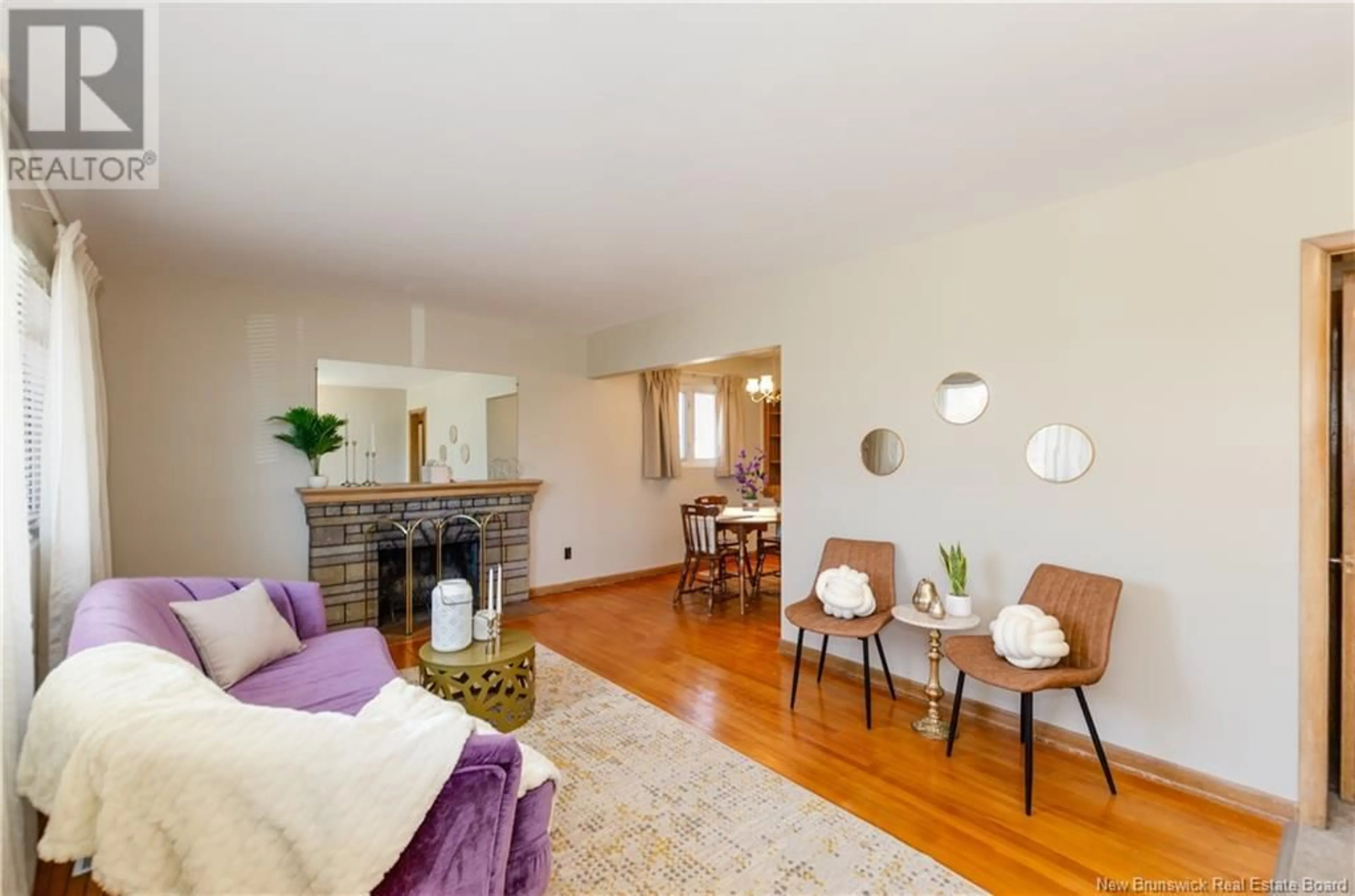 Living room with furniture, wood/laminate floor for 49 BISSETT AVENUE, Moncton New Brunswick E1E2S8