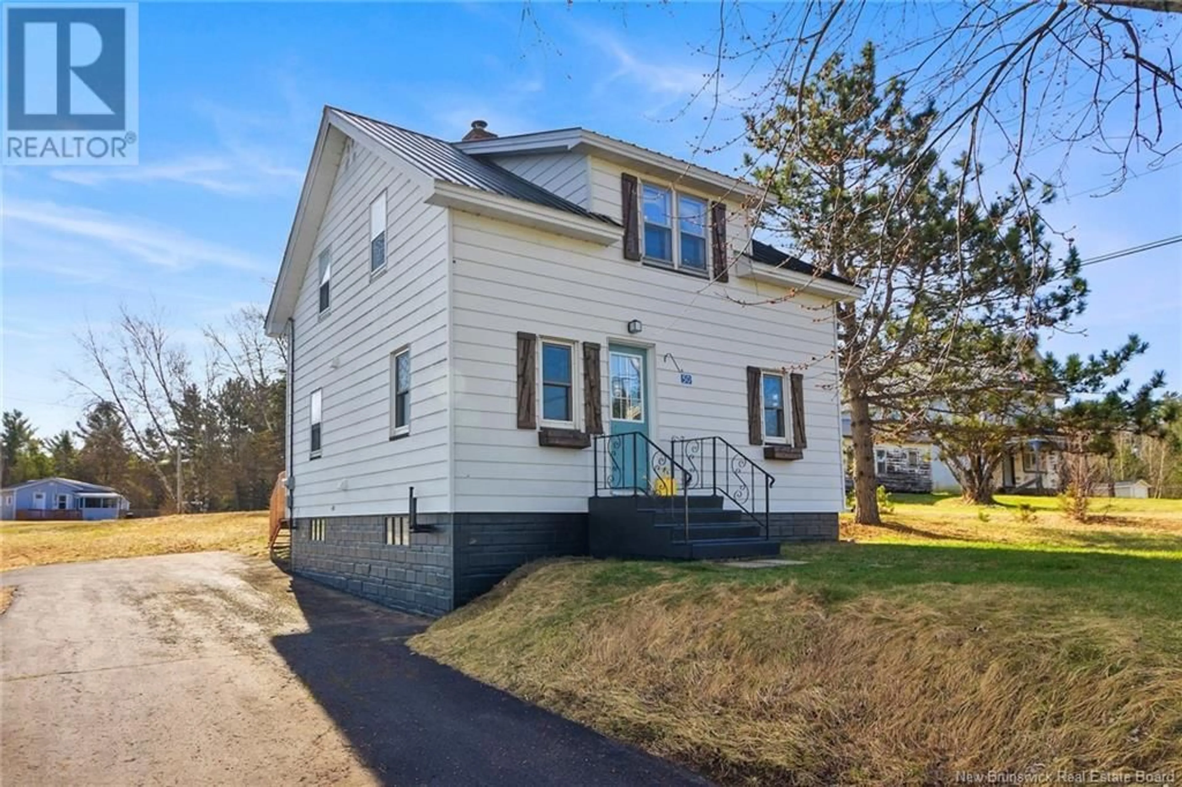 Home with vinyl exterior material, street for 50 MCLEOD AVENUE, Chipman New Brunswick E4A2B8