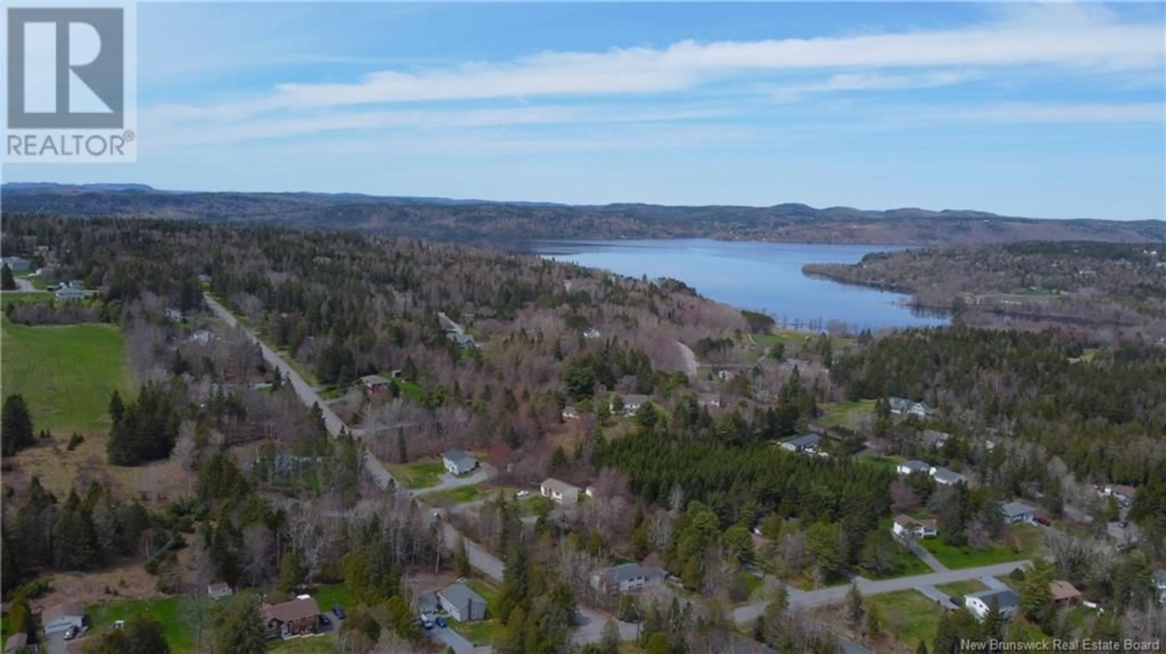 A pic from outside/outdoor area/front of a property/back of a property/a pic from drone, water/lake/river/ocean view for 7 RYNLON CRESCENT, Quispamsis New Brunswick E2G1A5