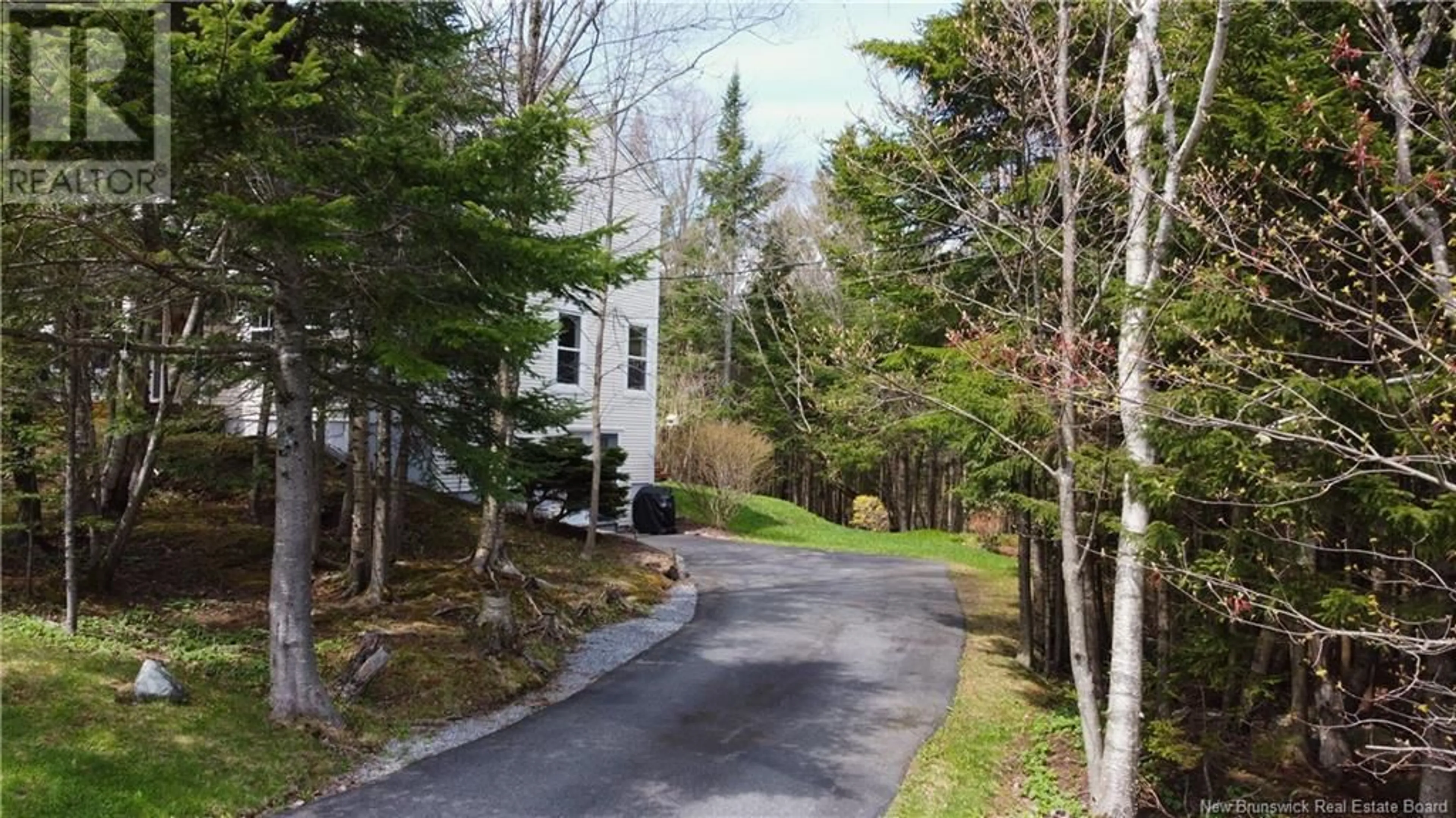 A pic from outside/outdoor area/front of a property/back of a property/a pic from drone, forest/trees view for 7 RYNLON CRESCENT, Quispamsis New Brunswick E2G1A5