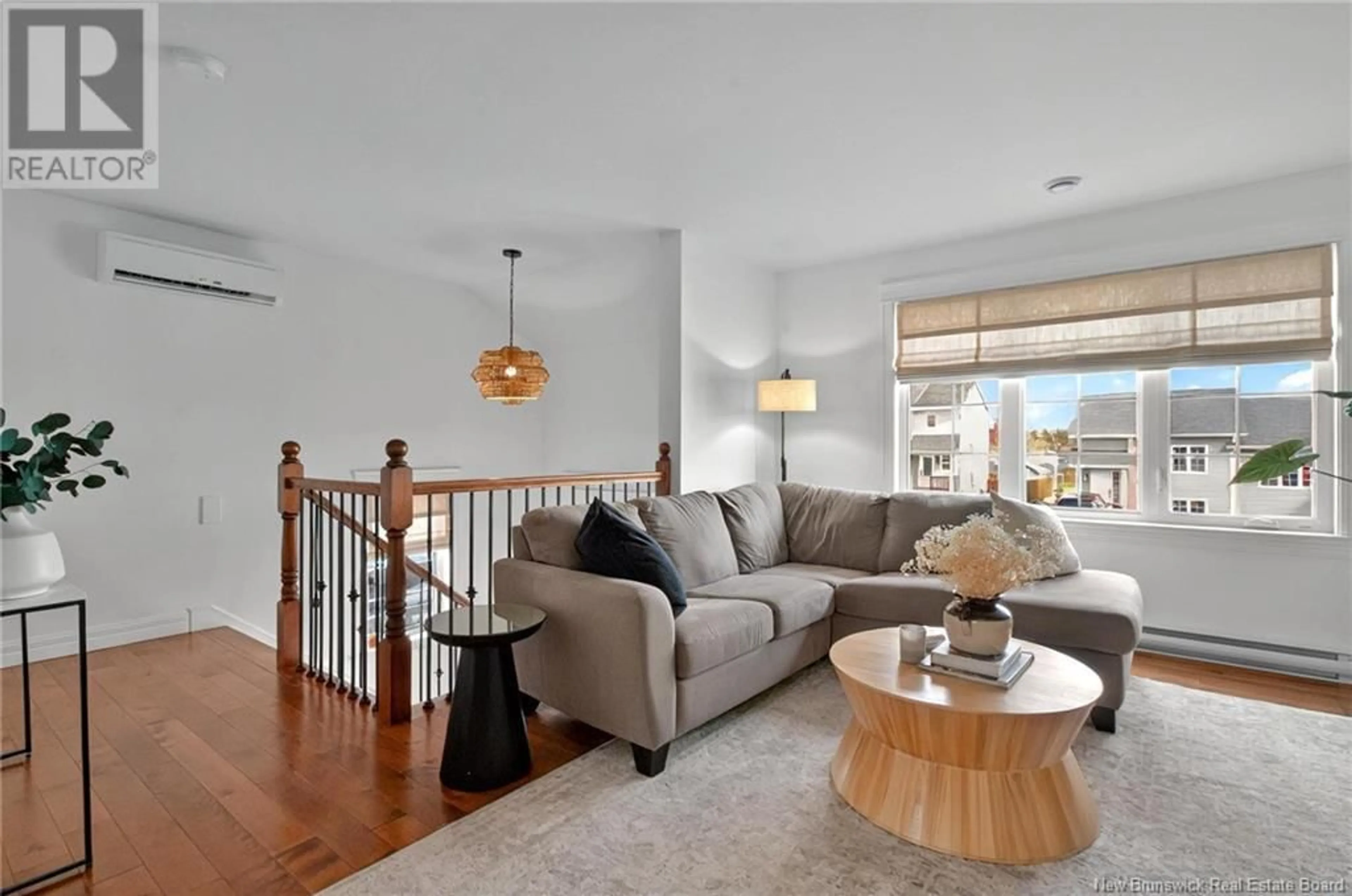 Living room with furniture, wood/laminate floor for 921 BERNARD STREET, Dieppe New Brunswick E1A4A6