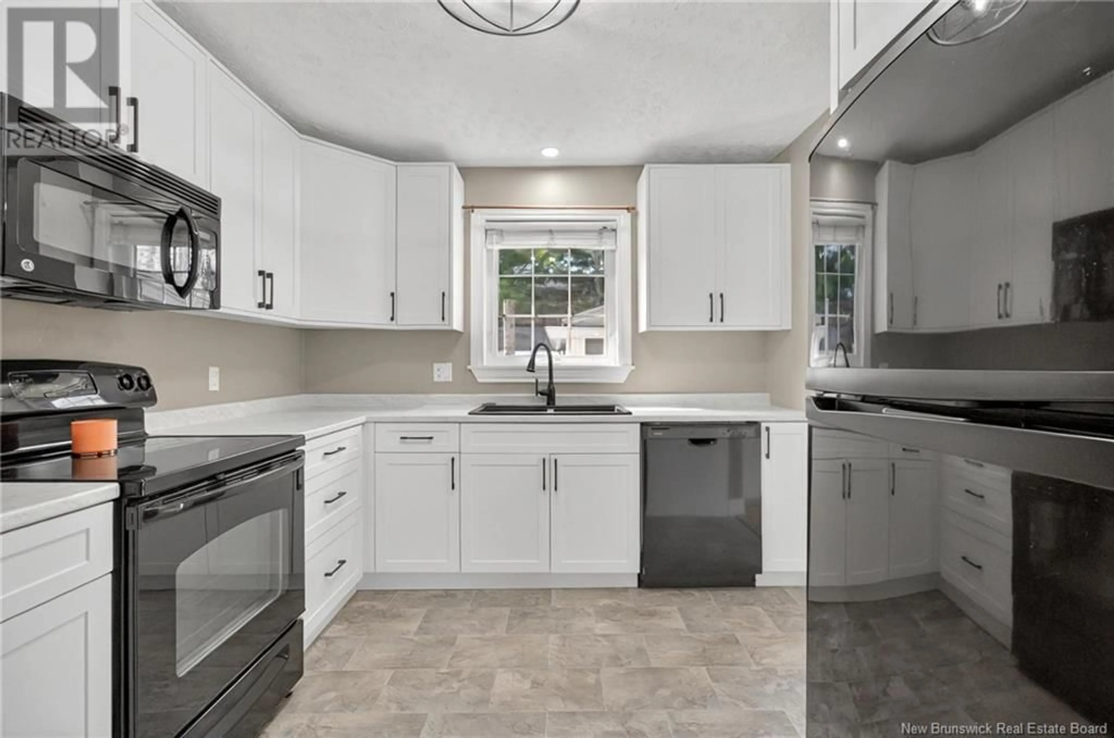 Open concept kitchen, ceramic/tile floor for 52 KENDRA STREET, Moncton New Brunswick E1C4J8
