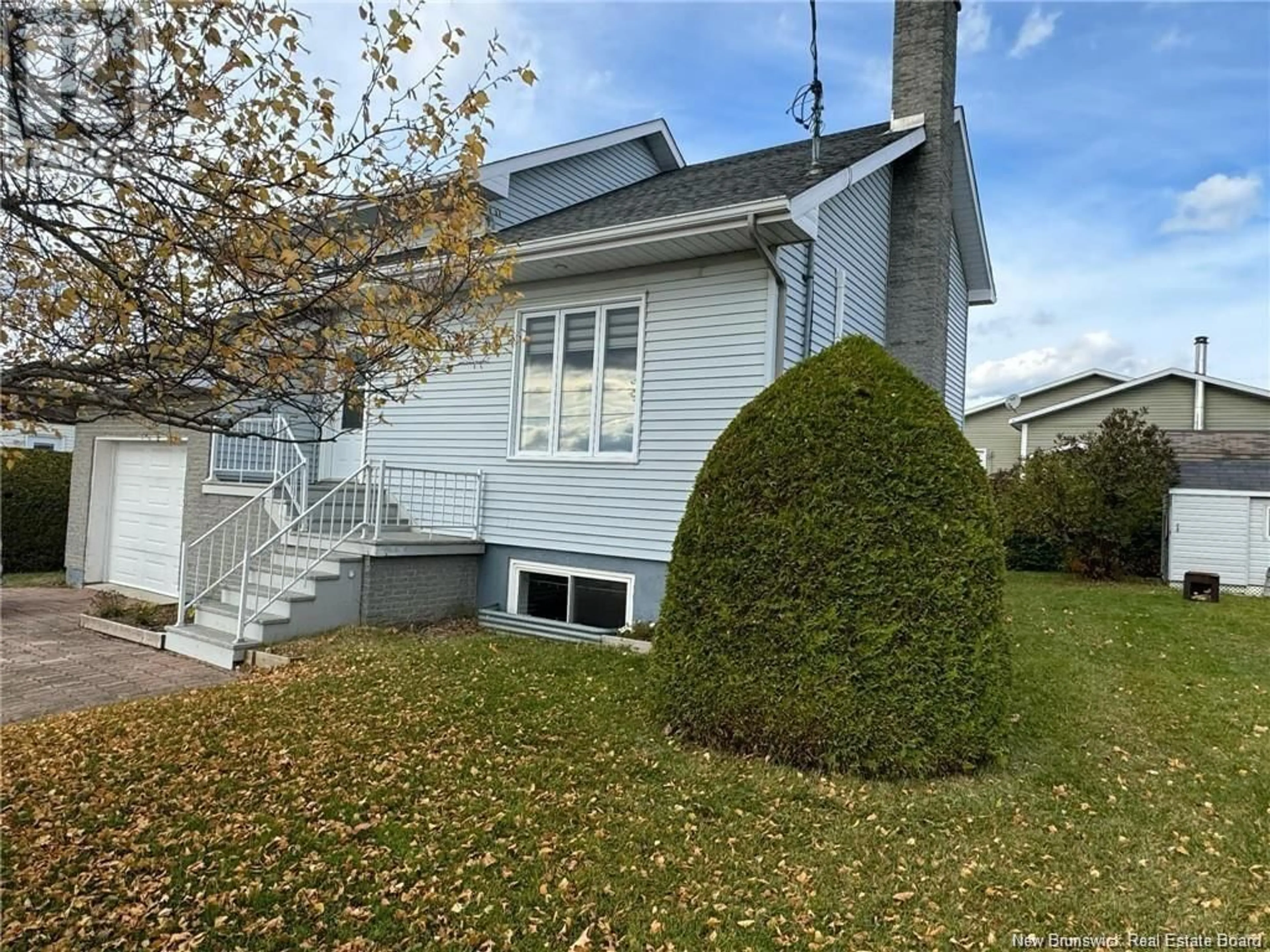 Home with vinyl exterior material, street for 24 RUE DESCHÊNES, Saint-Quentin New Brunswick E8A1M1