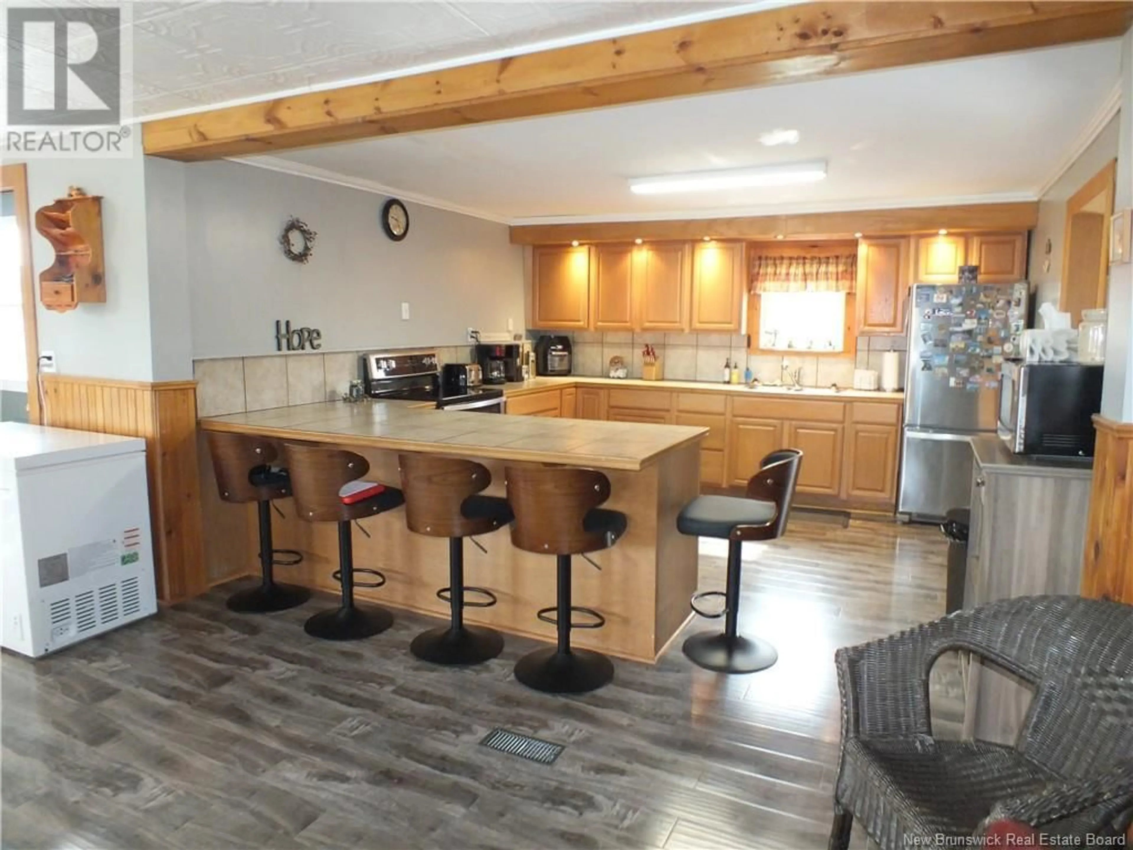 Open concept kitchen, wood/laminate floor for 809 BACK GREENFIELD ROAD, Summerfield New Brunswick E7K2L1