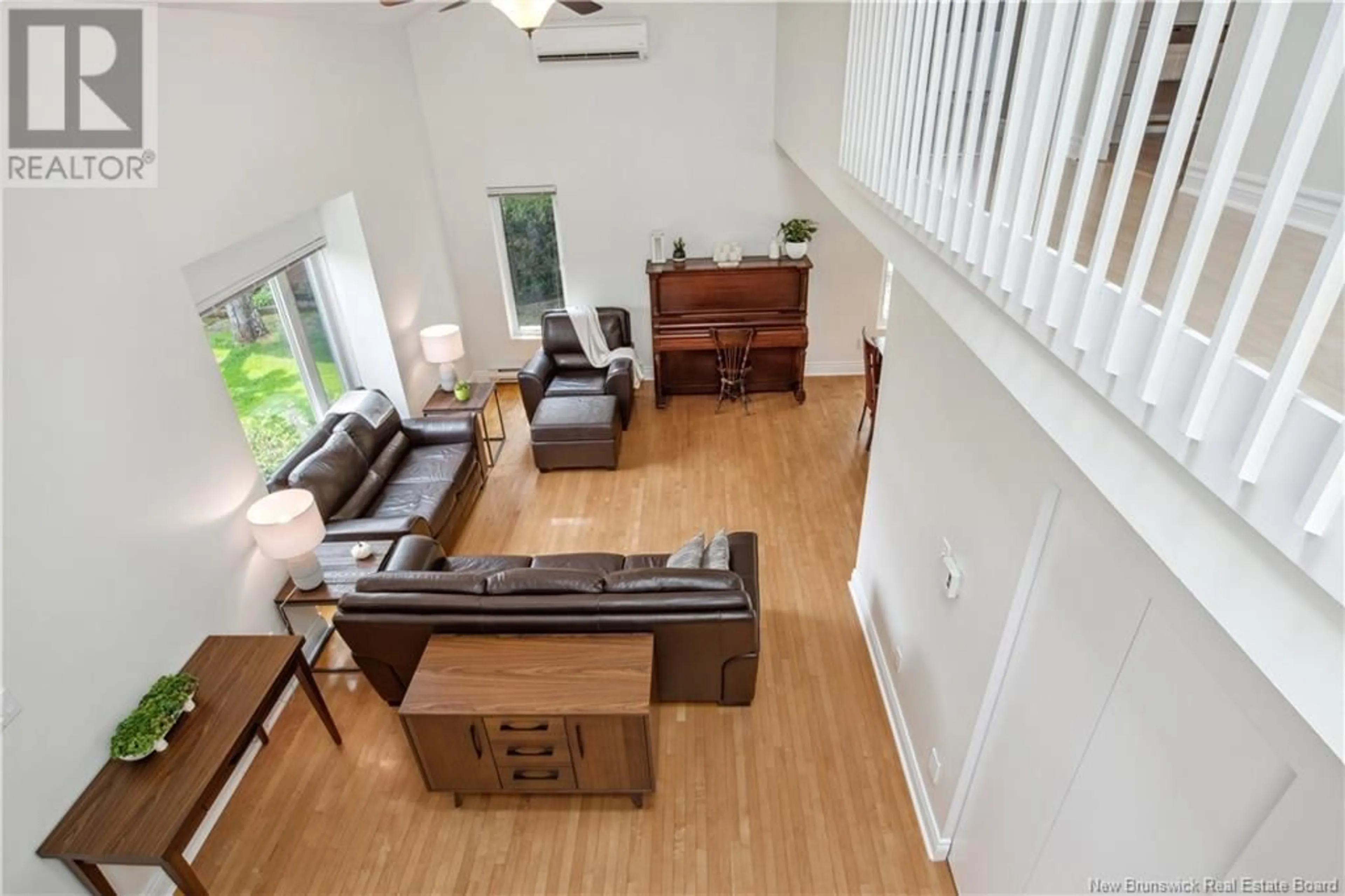 Living room with furniture, wood/laminate floor for 682 VICTOR, Dieppe New Brunswick E1A6G7