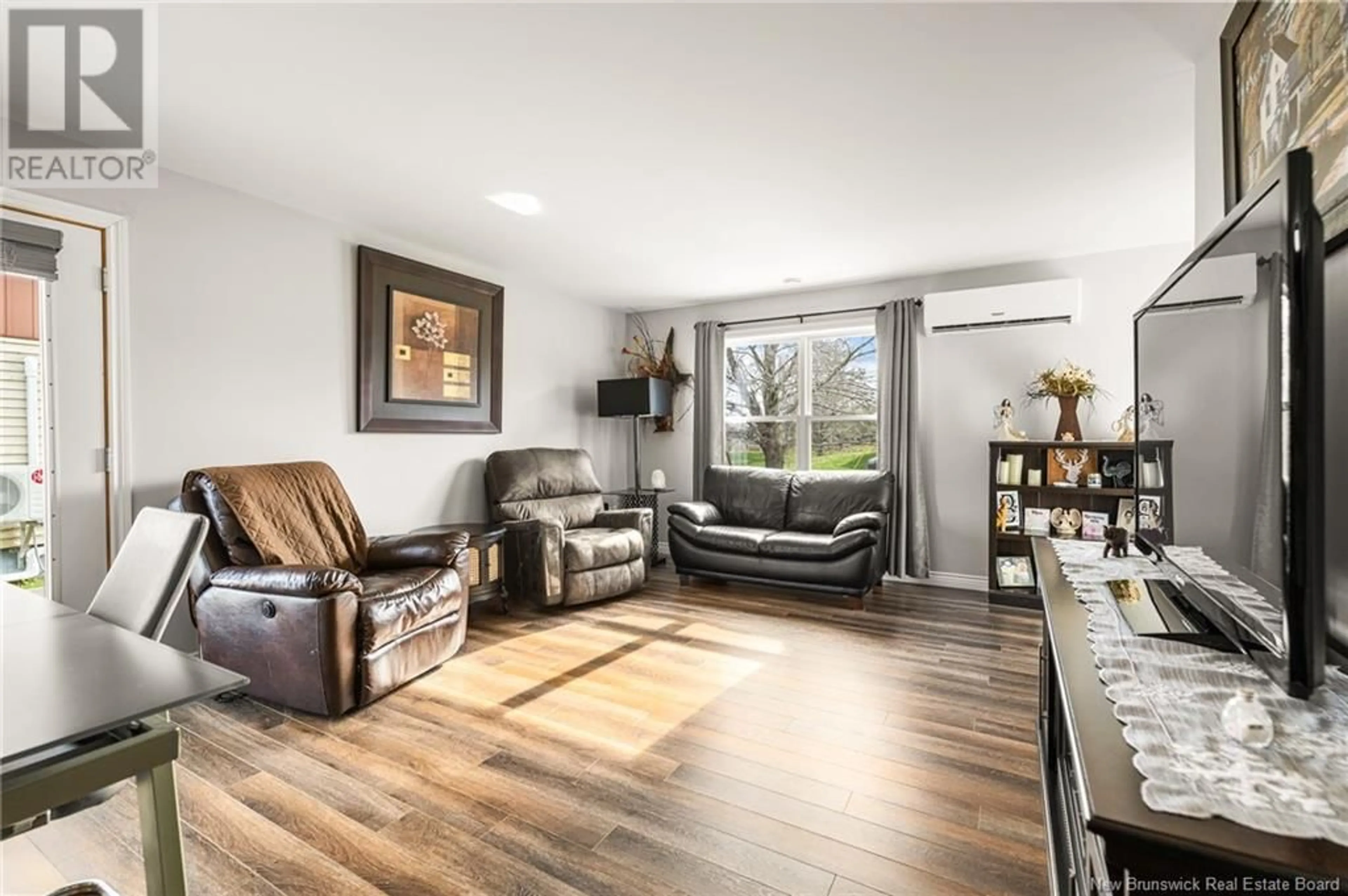 Living room with furniture, wood/laminate floor for 39 FOREST STREET, Cap-Pelé New Brunswick E4N1T2