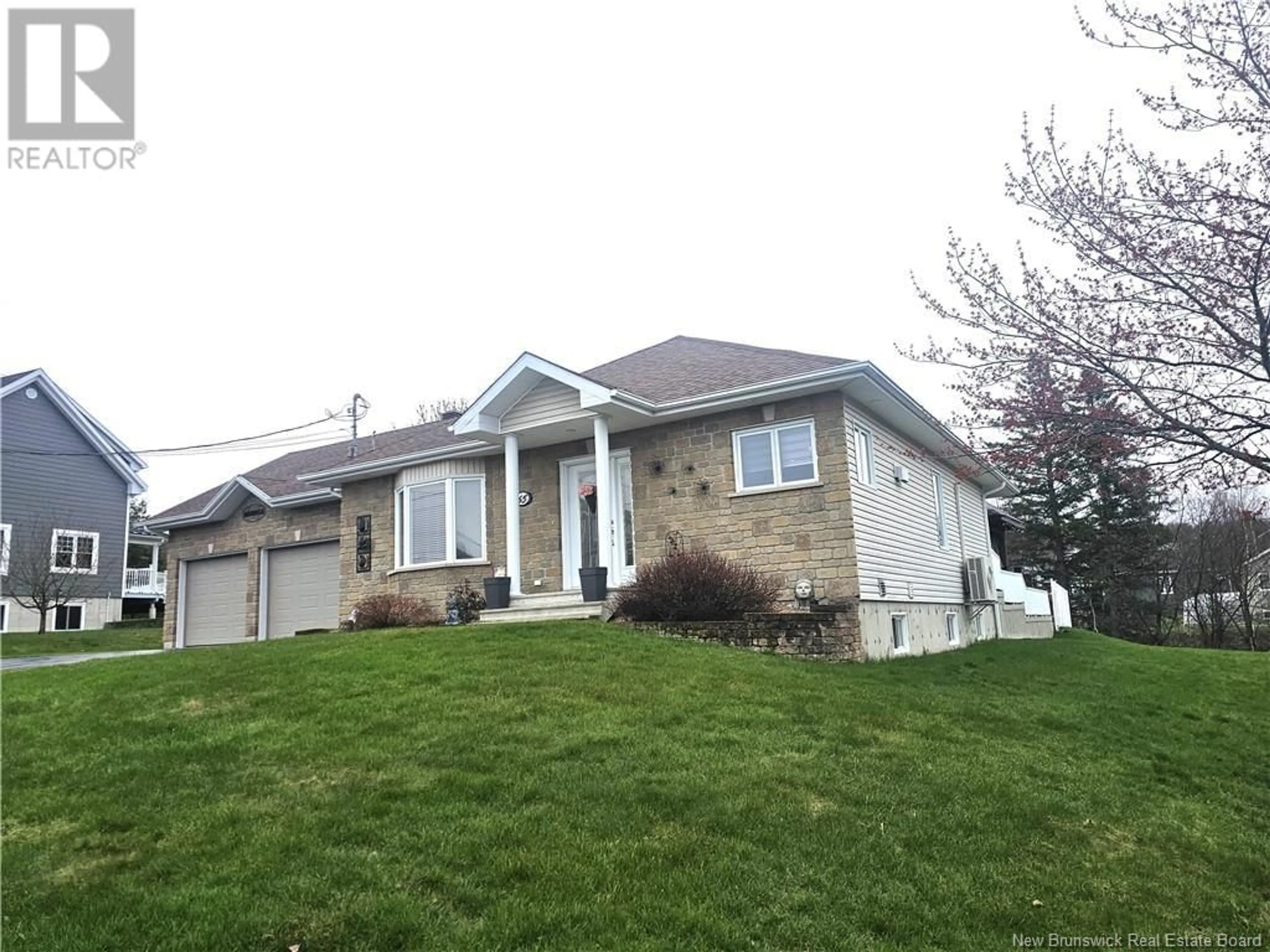 Home with vinyl exterior material, street for 65 MGR. DIONNE AVENUE, Edmundston New Brunswick E3V4B2